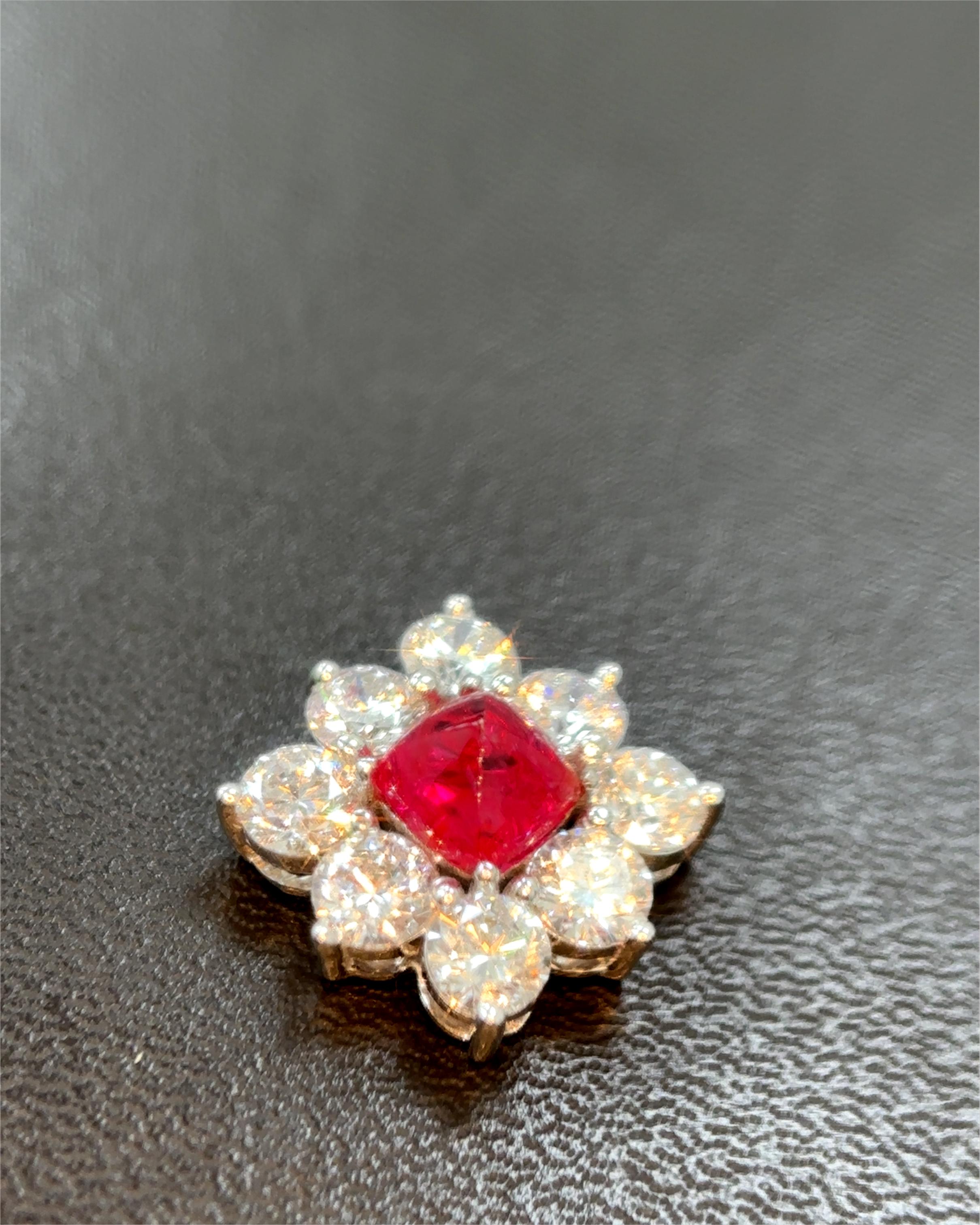 Embrace the allure of rare elegance with this stunning pendant that can also be worn as a brooch, masterfully crafted to embody timeless luxury and sophisticated beauty. Mounted in the finest 18k white gold, this extraordinary piece showcases an