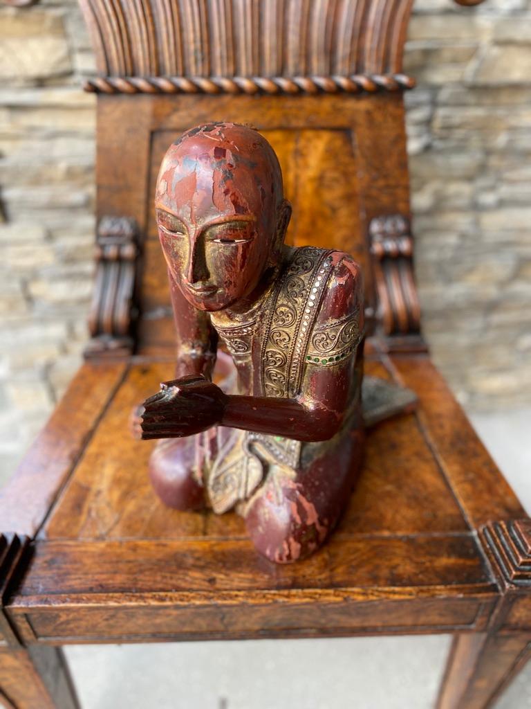 Burma wooden hand carved Serena in classic praying monk statue
positioned all in red lacquer with 