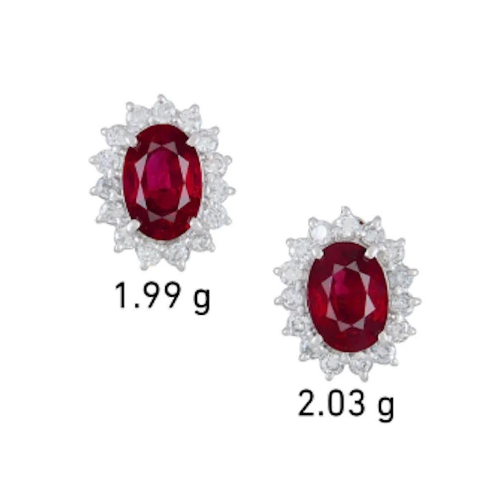 Simply Beautiful! Finely detailed GIA Burma Rubies and Diamond Platinum Stud Earrings. Each center securely nestled Hand set with a GIA Ruby, weighing 1.38 Carat & 1.49 Carat; approx. total weight of the 2 Rubies 2.87tcw, surrounded by Diamonds,