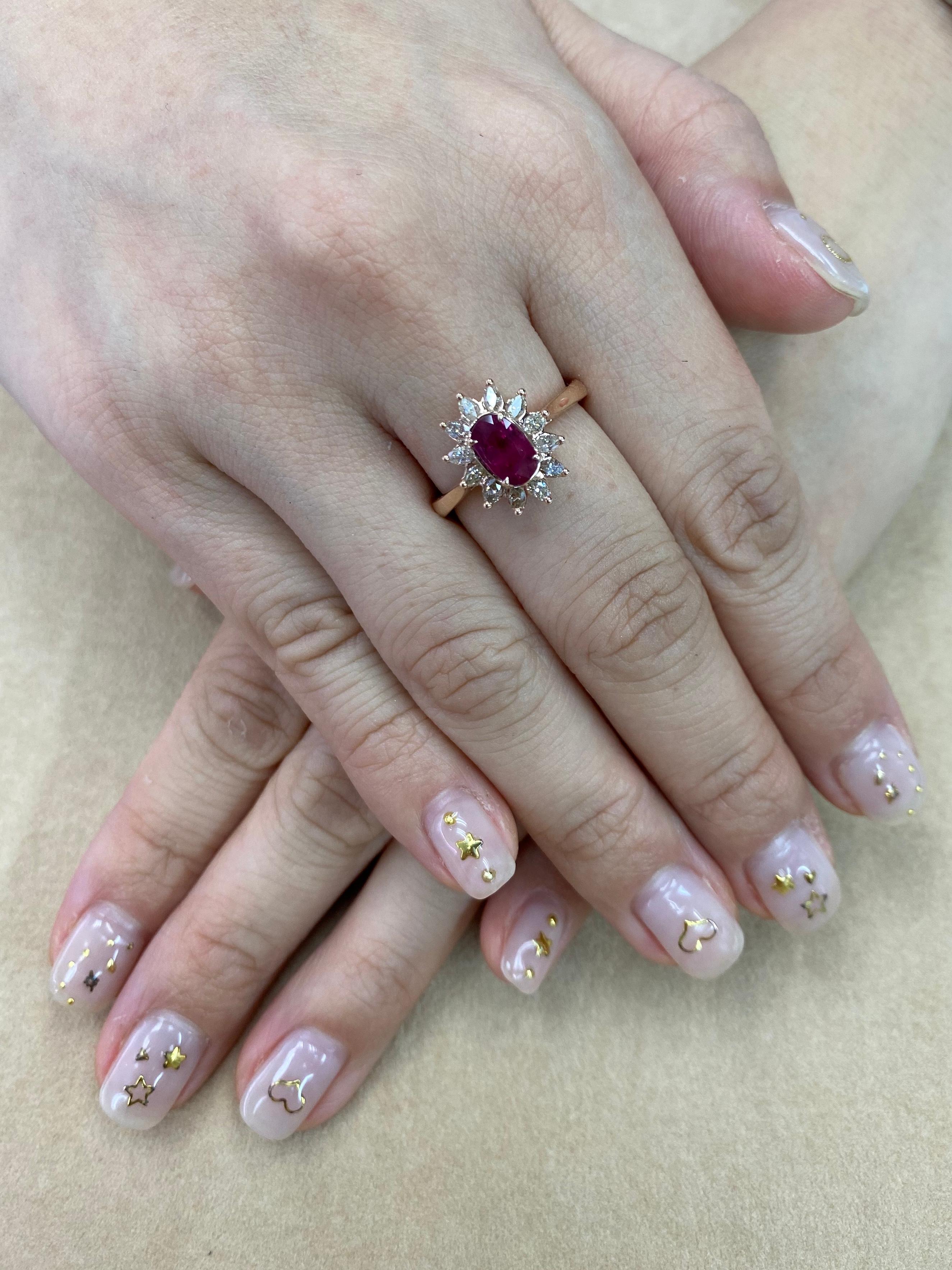 Here is a nice Burma Ruby and diamond flower cocktail ring. The nice red ruby is 1.14 cts with strong fluorescence under black light. The ring is set in 18k rose gold and marquise diamonds. Marquise diamonds totaling 0.49 carats. The photos does not