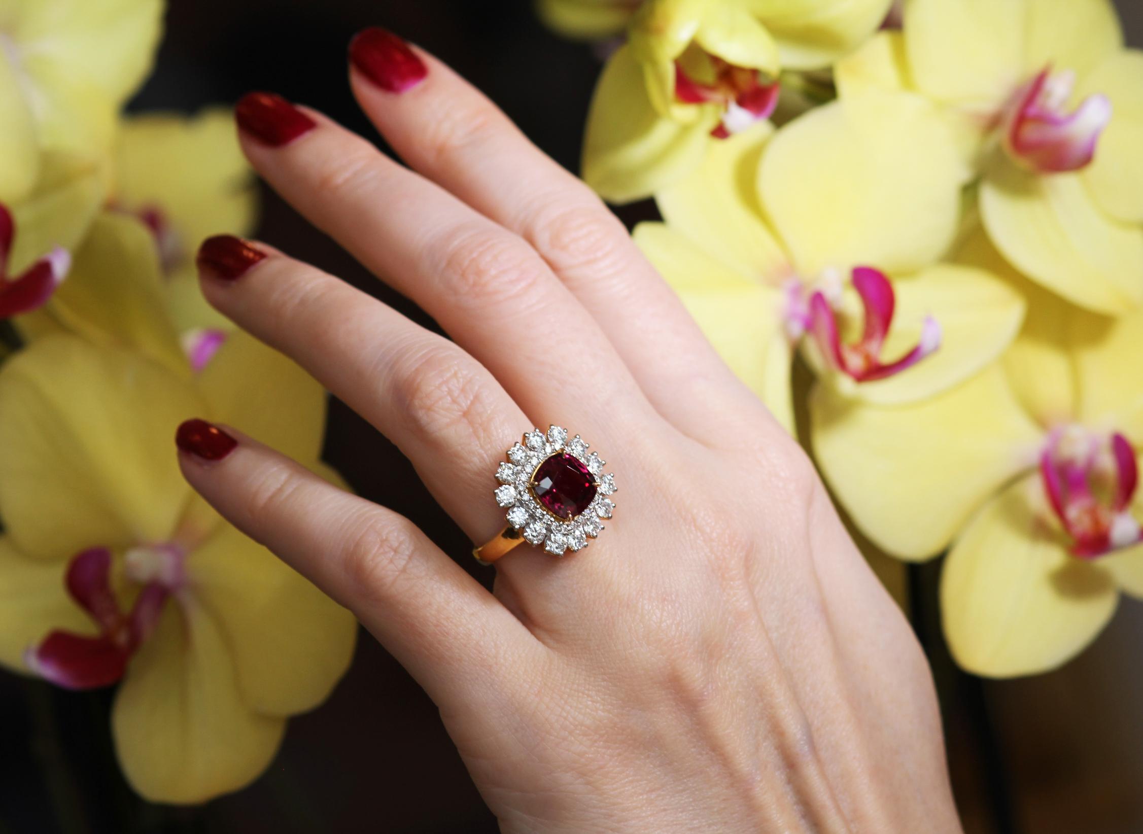 Striking, vibrant red natural 'no heat' Burma cushion cut ruby framed with a border of brilliant white round brilliant cut diamonds.

Certified by the world-famous SSEF laboratory in Switzerland, Natural Ruby, Origin - Myanmar

Ruby measurements: