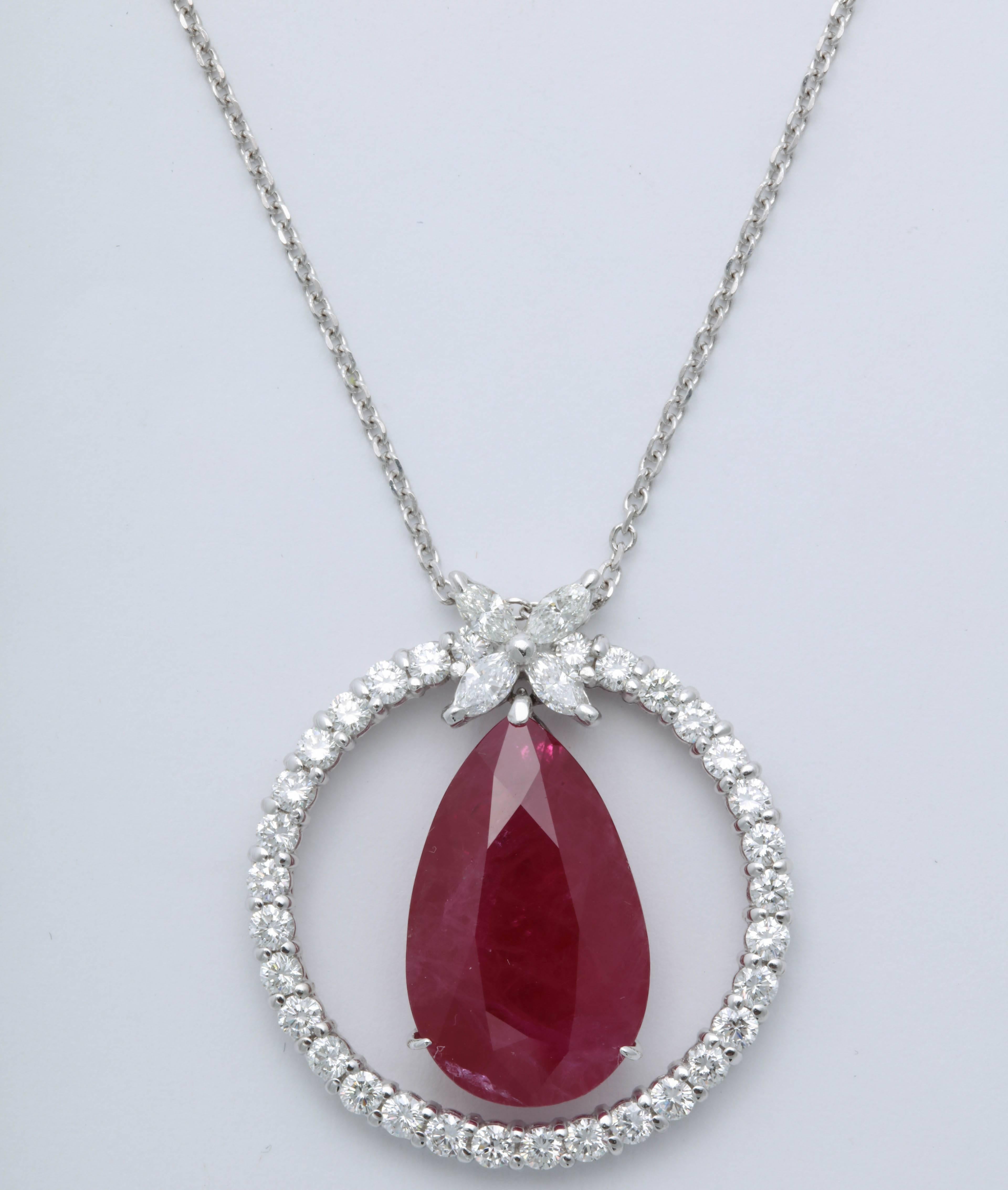 

A unique and stunning piece!!

11.62 carat pear shape Burma Ruby certified by GIA. 

2.08 carats of marquise and round white diamonds. 

18k white gold 

The pendant is hanging from an 18 inch white gold chain.

The pendant is approximately 1.15