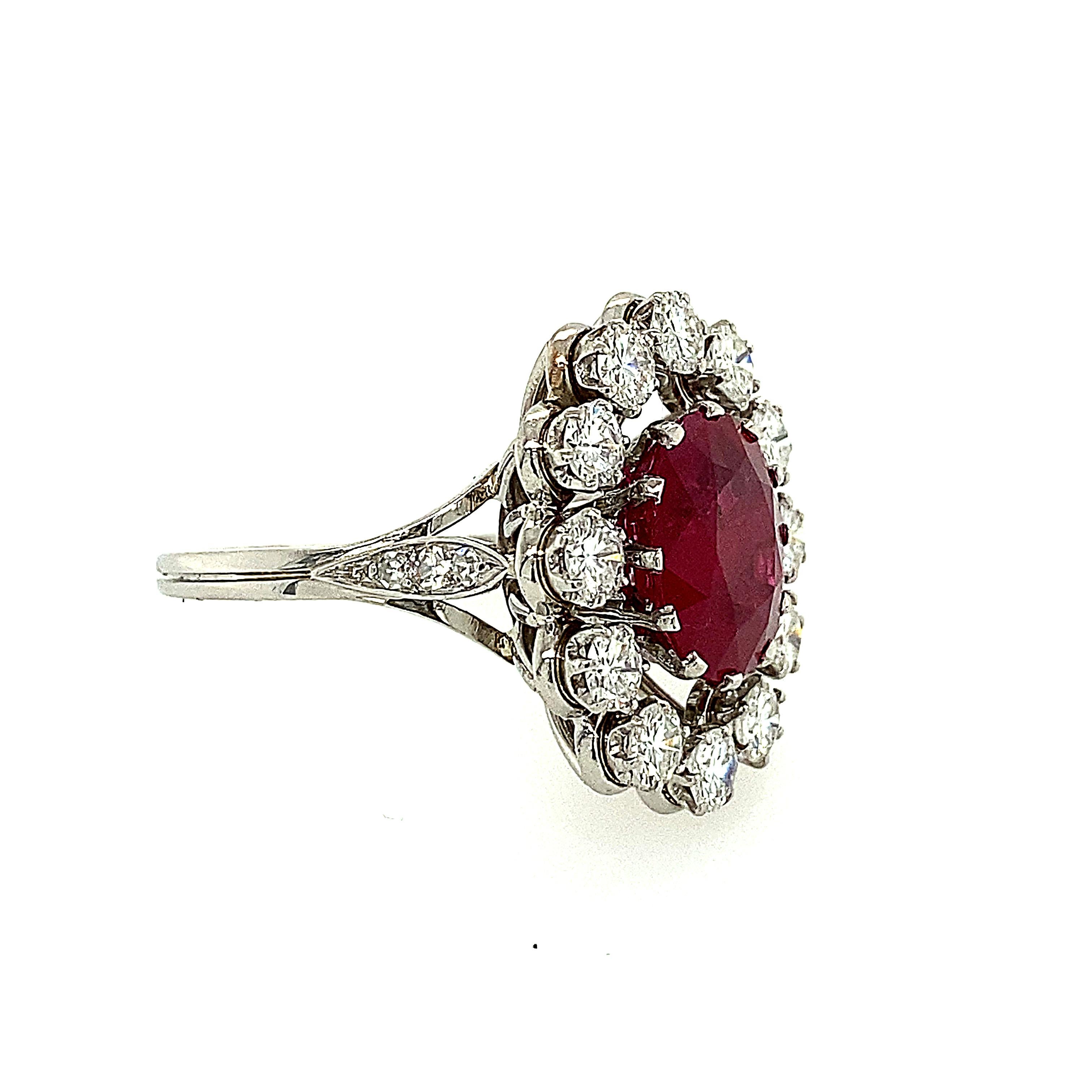 Fabulous AGL Certified Burma origin ruby weighing 3.76 carats. There are approximately 1.30 carats of round brilliant diamonds surrounding the Ruby. The ring is platinum and circa 1940-1950. The Ruby has an AGL Certificate.