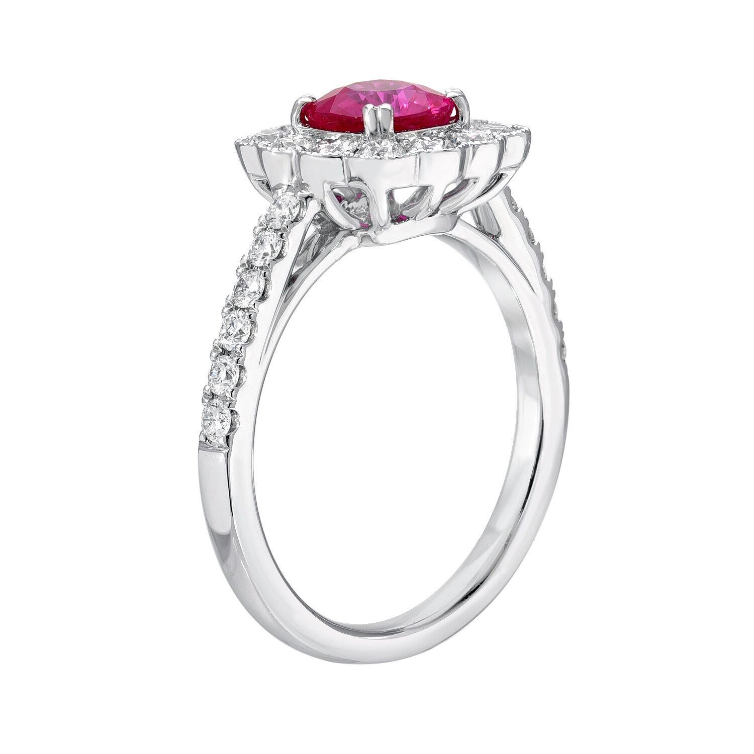 Vibrant Burmese Ruby cushion cut weighing a total of 1.12 carats is set in this classic 0.70 carat total round brilliant diamond, 18K white gold engagement ring or cocktail ring.
Size 6.5. Re-sizing is complimentary upon request.
Returns are