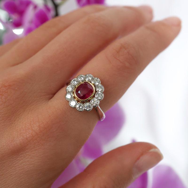 Oval Cut Burma Ruby, Diamond and Platinum Cluster Ring, 0.97 Carats For Sale