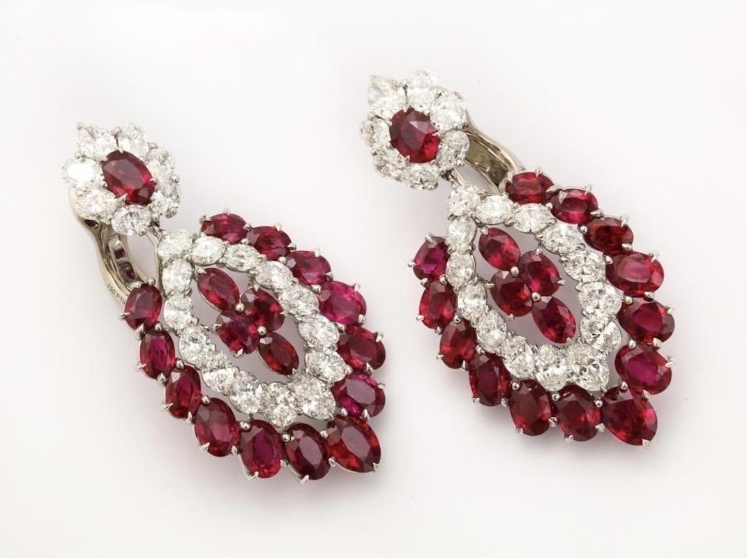 No gemstone represents a celebration more than a bright, red ruby and these amazing chandelier earrings have 36 of them.  The 42 bright, white oval diamonds also hold their own at any festive event.  The design of the earrings is classical and will