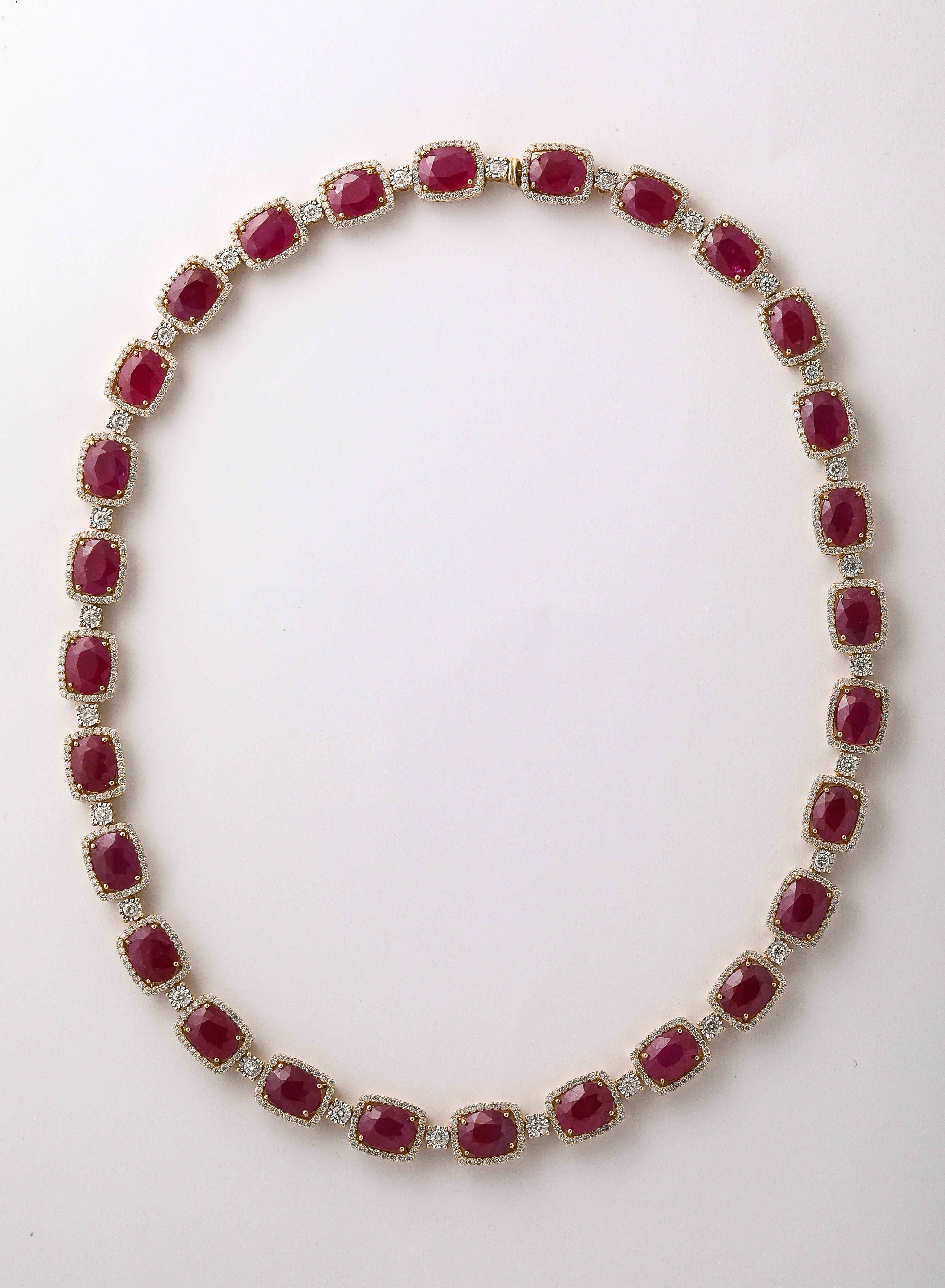 

72.70 carats of oval Burma Ruby. 

6.38 carats of white round brilliant cut diamonds. 

14k yellow gold. 

17 inch length 

A matching bracelet is available in our 1stDibs store.