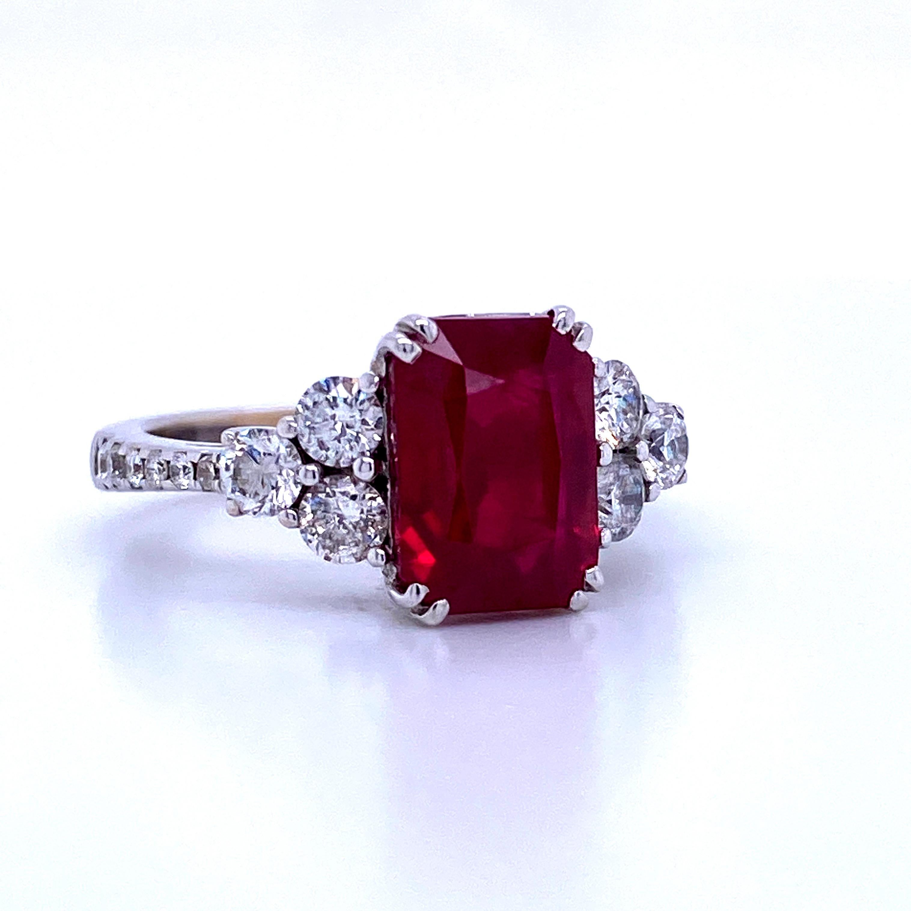 18K White gold ring featuring one Burma Ruby weighing 3.99 carats flanked with round brilliants weighing 0.80 carats. AGL Certified. 
A true beauty! 