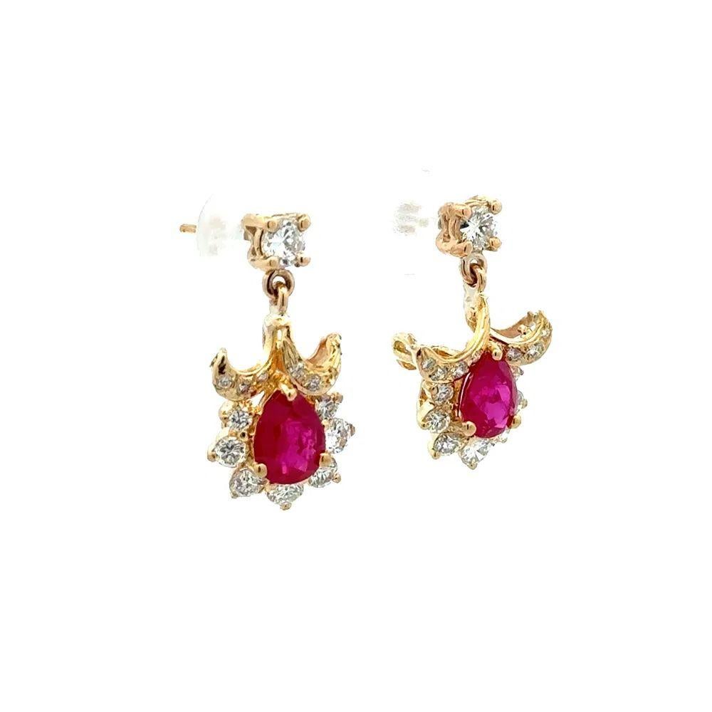 Simply Beautiful! Elegant and Finely detailed Burma Ruby GIA and RBC Diamond Gold Drop Earrings. Hand set with Burma Ruby Gia Gemstones and Round Brilliant Cut Diamonds. Approx. total weight of the 2 Rubies 2.70 Carats and enhanced with Diamonds,