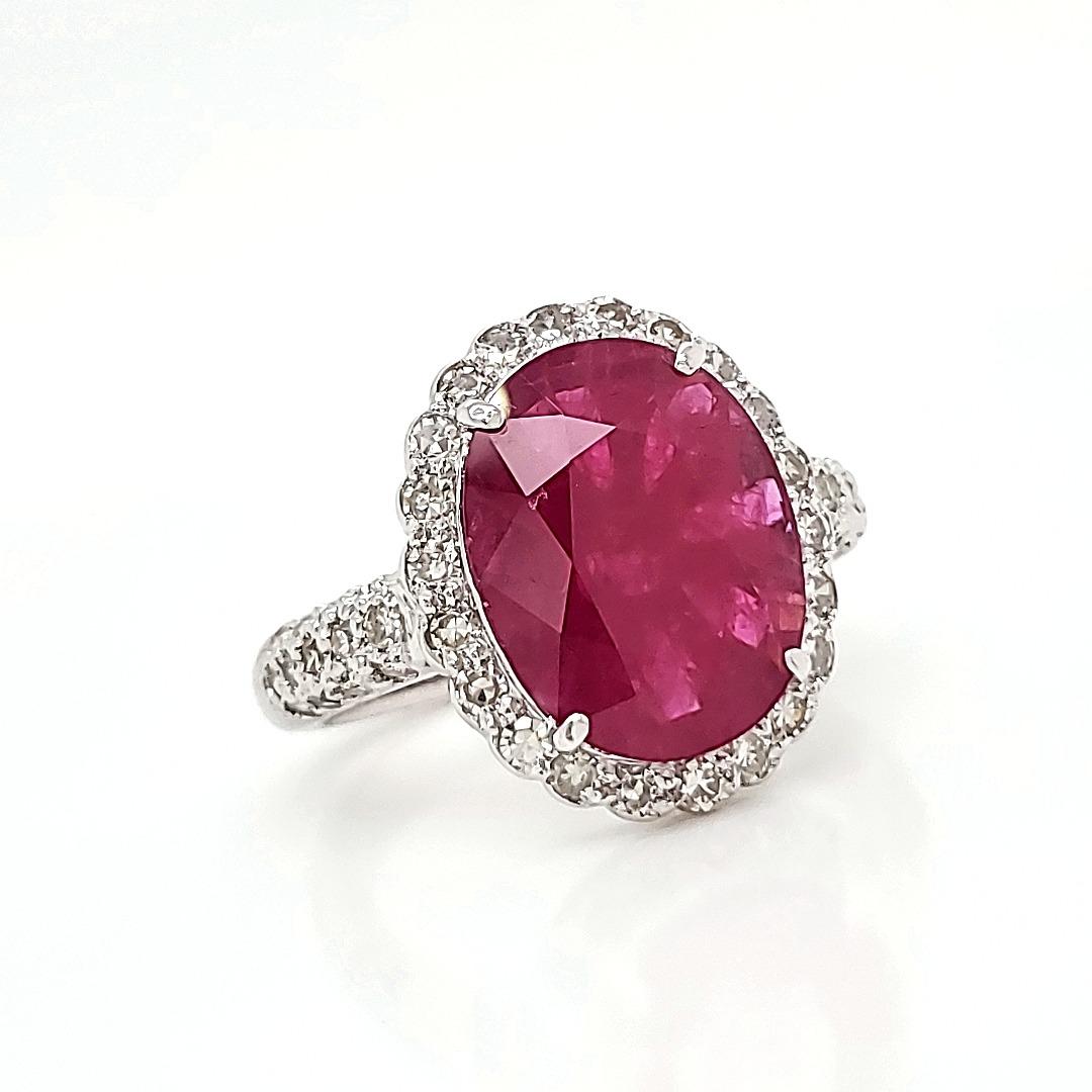 Burma Ruby Oval 4 cts Ring with Diamonds

This well-faced 4.11 cts Heated Burma Ruby Oval  sits pretty on top of a prong set base and surrounded by 48 diamonds of cts 0.66 weight.

The 4.11 ruby has a large face and well cut proportions therefore