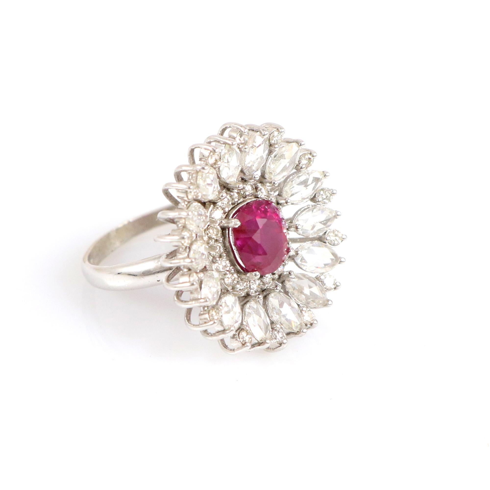 Experience the epitome of elegance with our exceptional gold ring adorned with natural Burma ruby and marquise-shaped rose-cut diamonds. These rare gemstones are celebrated for their intense red brilliance, beautifully complemented by subtle hints