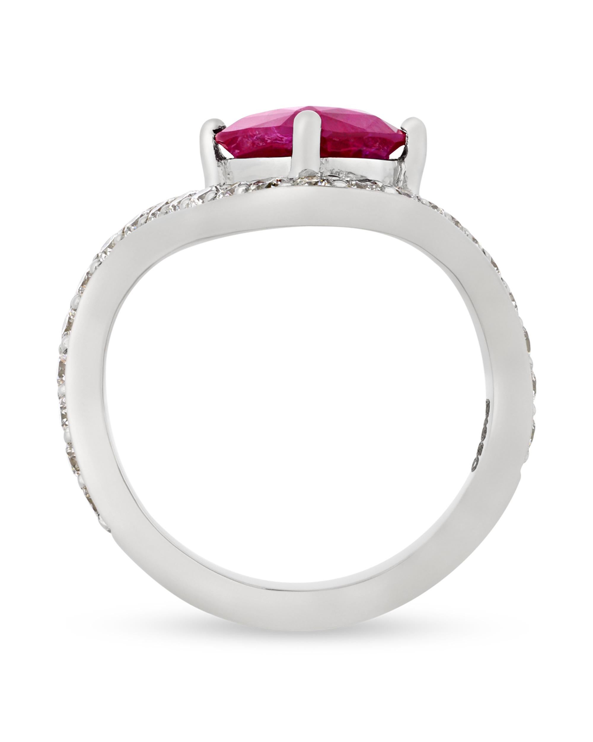 Chic and beautiful, this elegant ring features an exquisite untreated Burma ruby at the center. The radiant red gem weighs 2.39 carats and is certified by the American Gemological Laboratories as being completely unheated and originating from the