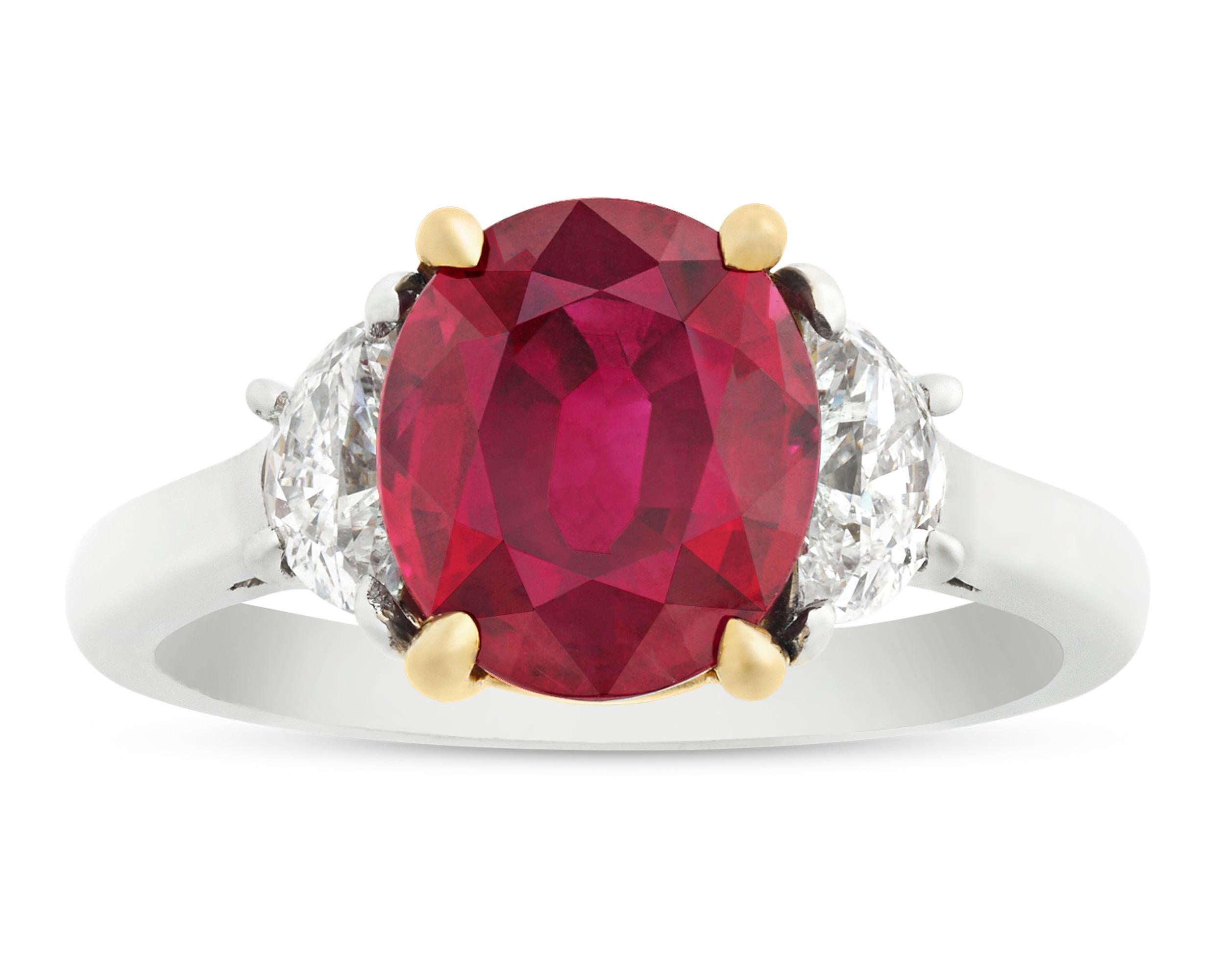 A 3.02-carat oval brilliant-cut Burma ruby exhibits a dramatic red hue in this classic ring. For centuries, the Burmese ruby has ranked among the most sought-after gemstones in the world, as stones that hail from these legendary mines are set apart