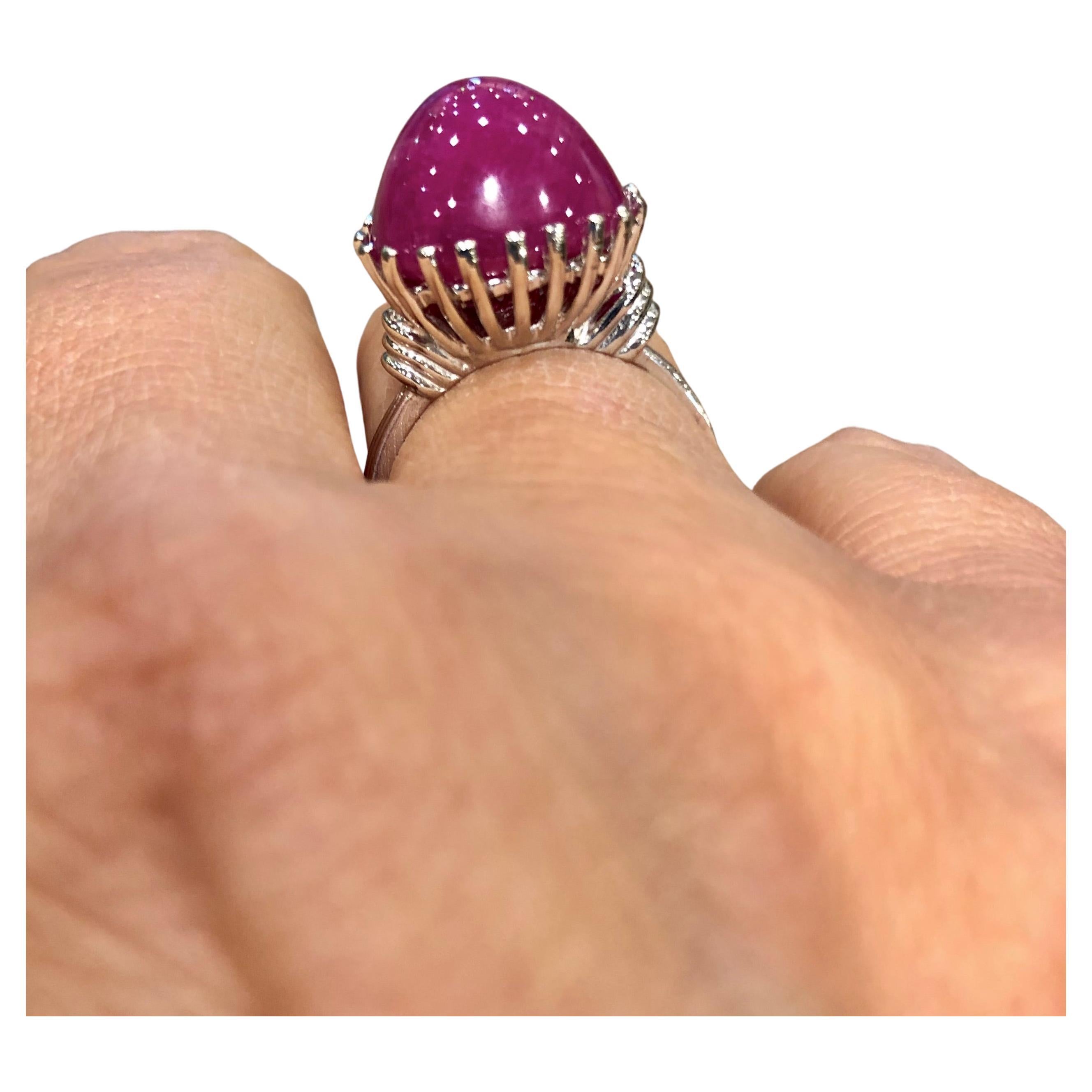 Stunning Statement Solitaire Cathedral Style Ring
Centering a 13.91 carats Burma Ruby sugarlof cabochon pinkish-red color.
Statement ring cabochon Burmese ruby crafted in white gold 14k. Size 7 