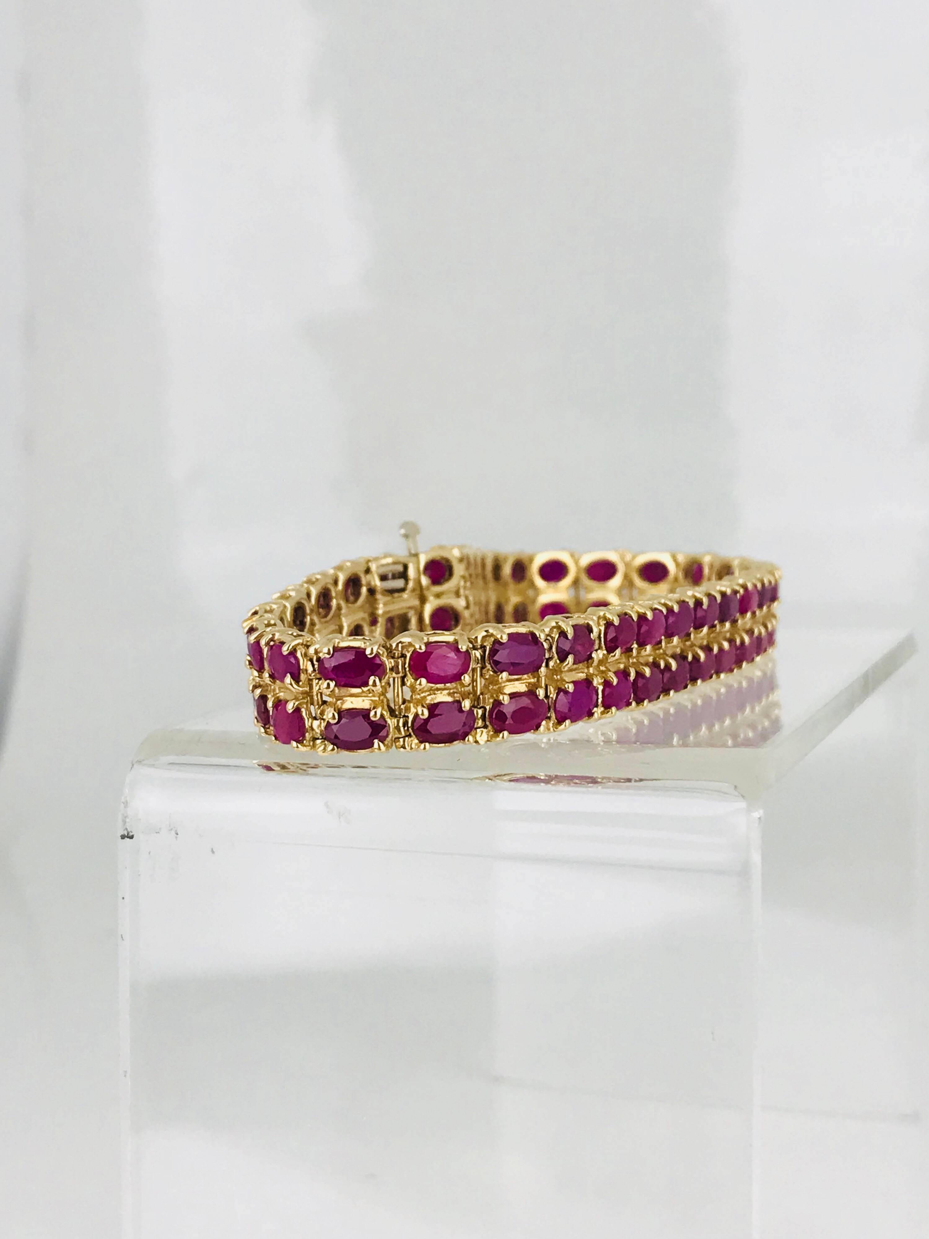 Burma Ruby Bracelet, consists of (62) oval shaped rubies measuring 2.80 x 4.50 millimeters in diameter. The total weight of rubies is estimated to be 25 carats.
Colors are deep ruby red .
7.5 inches in length.

GIA Gemologist inspected and evaluated