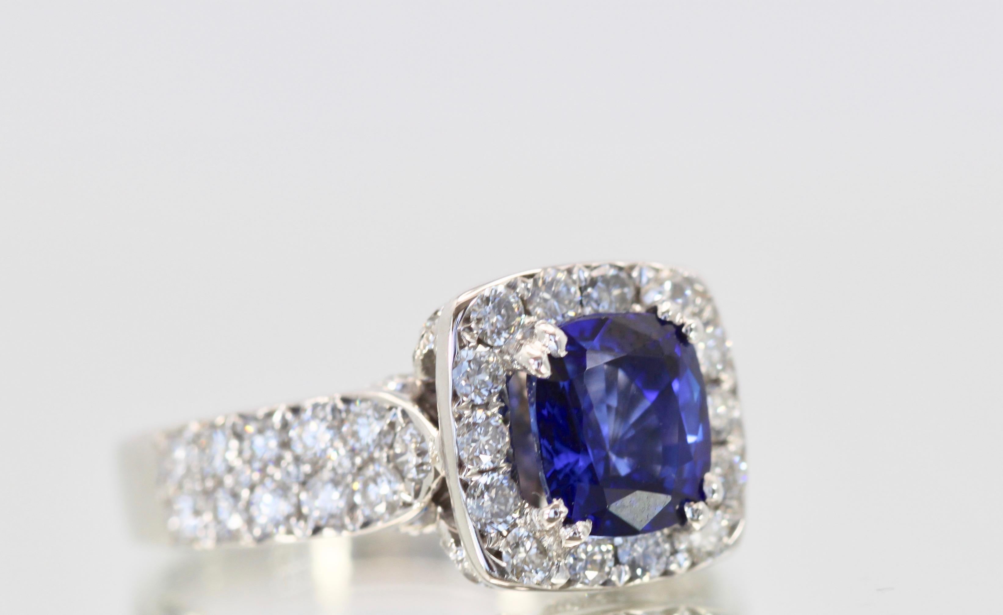 Contemporary Burma Sapphire Ring with Diamond Surround 18 Karat For Sale