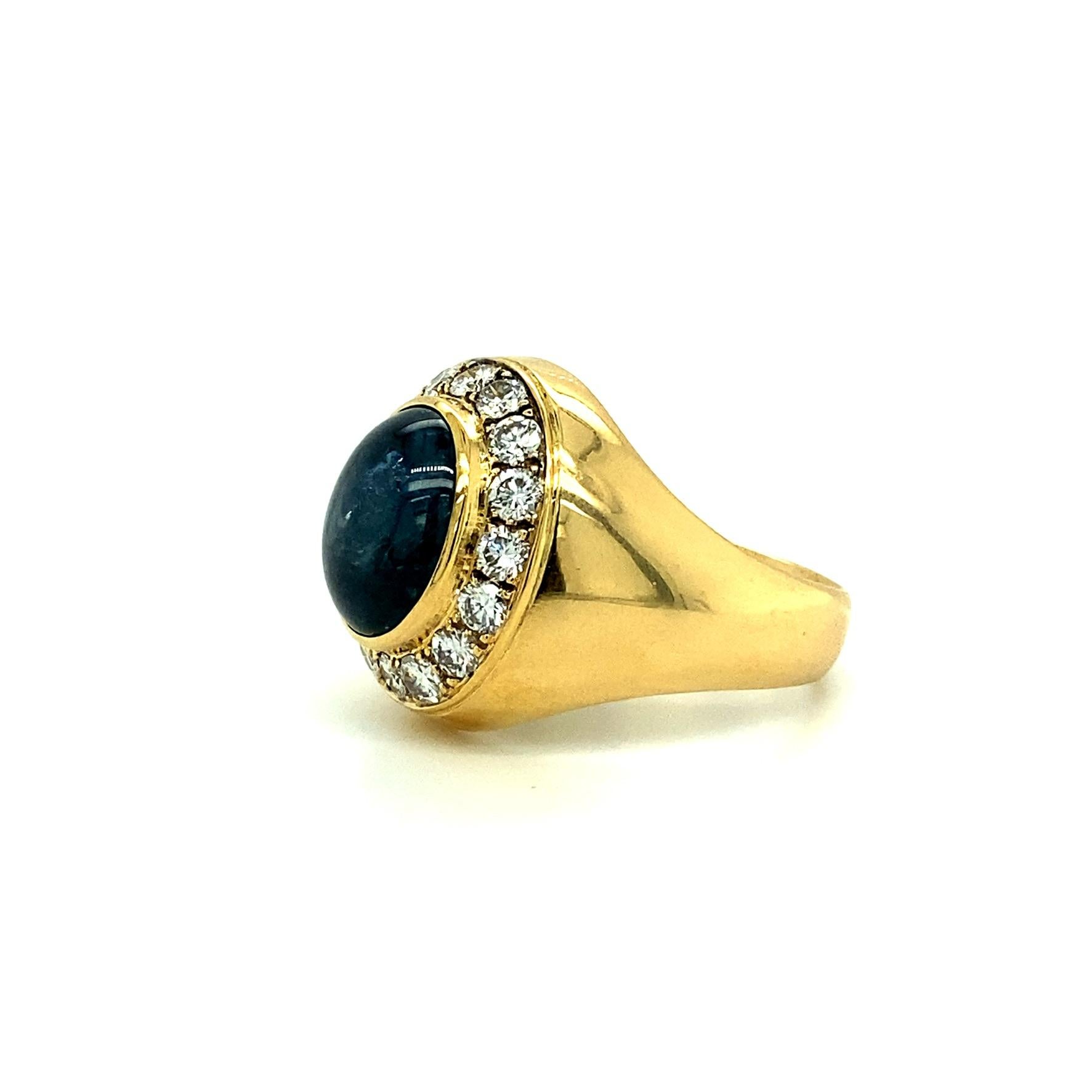 Offered here is a gorgeous large men’s ring, featuring one natural unheated earth-mined G.I.A certified oval cabachon blue star sapphire displaying asterism, weighing 16.25 ct. 
Framed with 16 natural sparkly bright white diamonds weighing