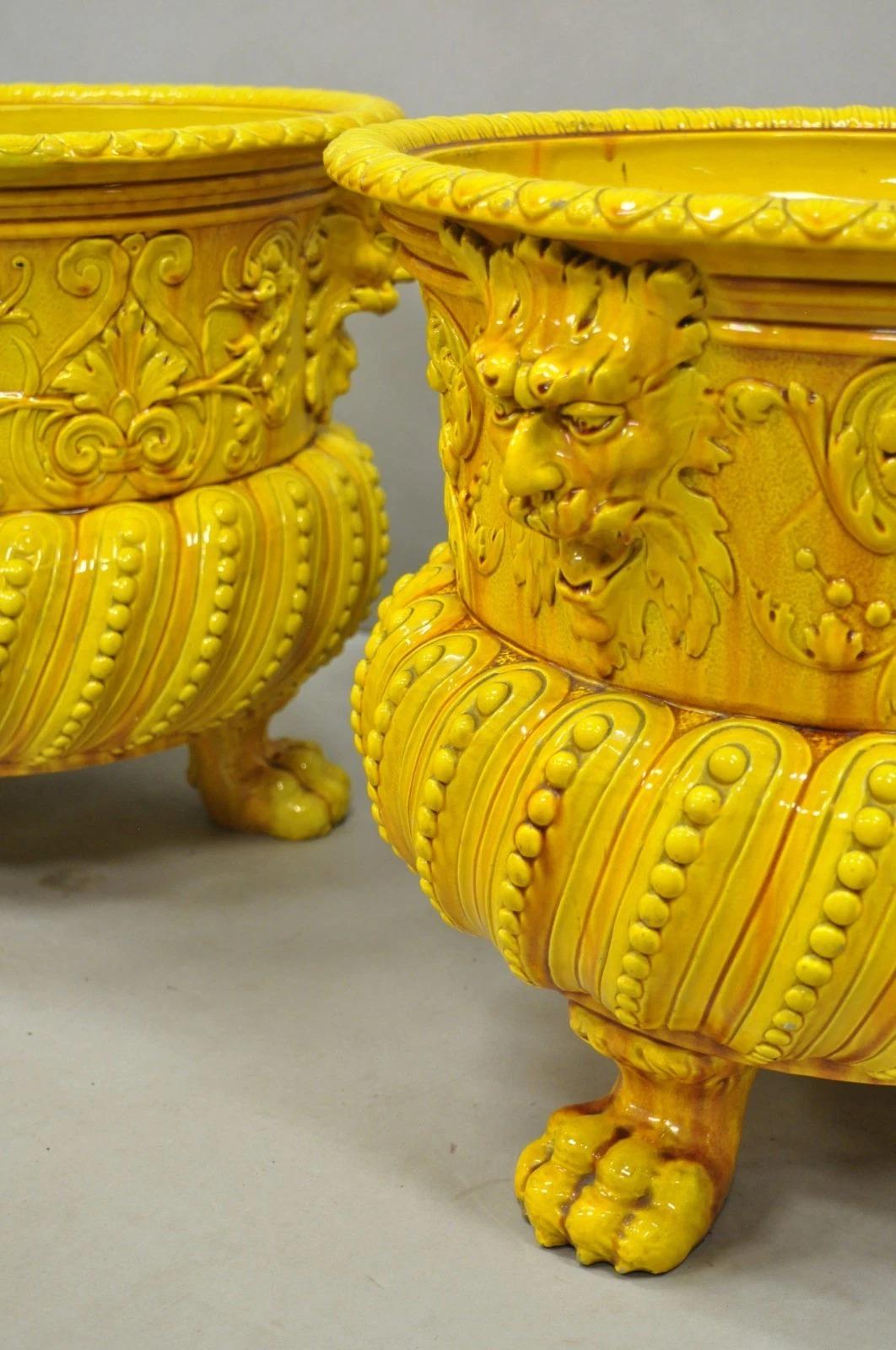 Please message us with your zip code to request a more reasonable domestic U.S. shipping quote.

Antique Burmantofts Faience Majolica English Regency Yellow Glazed Figural Jardiniere Planter Pots - a Pair. Item features elaborate form standing on