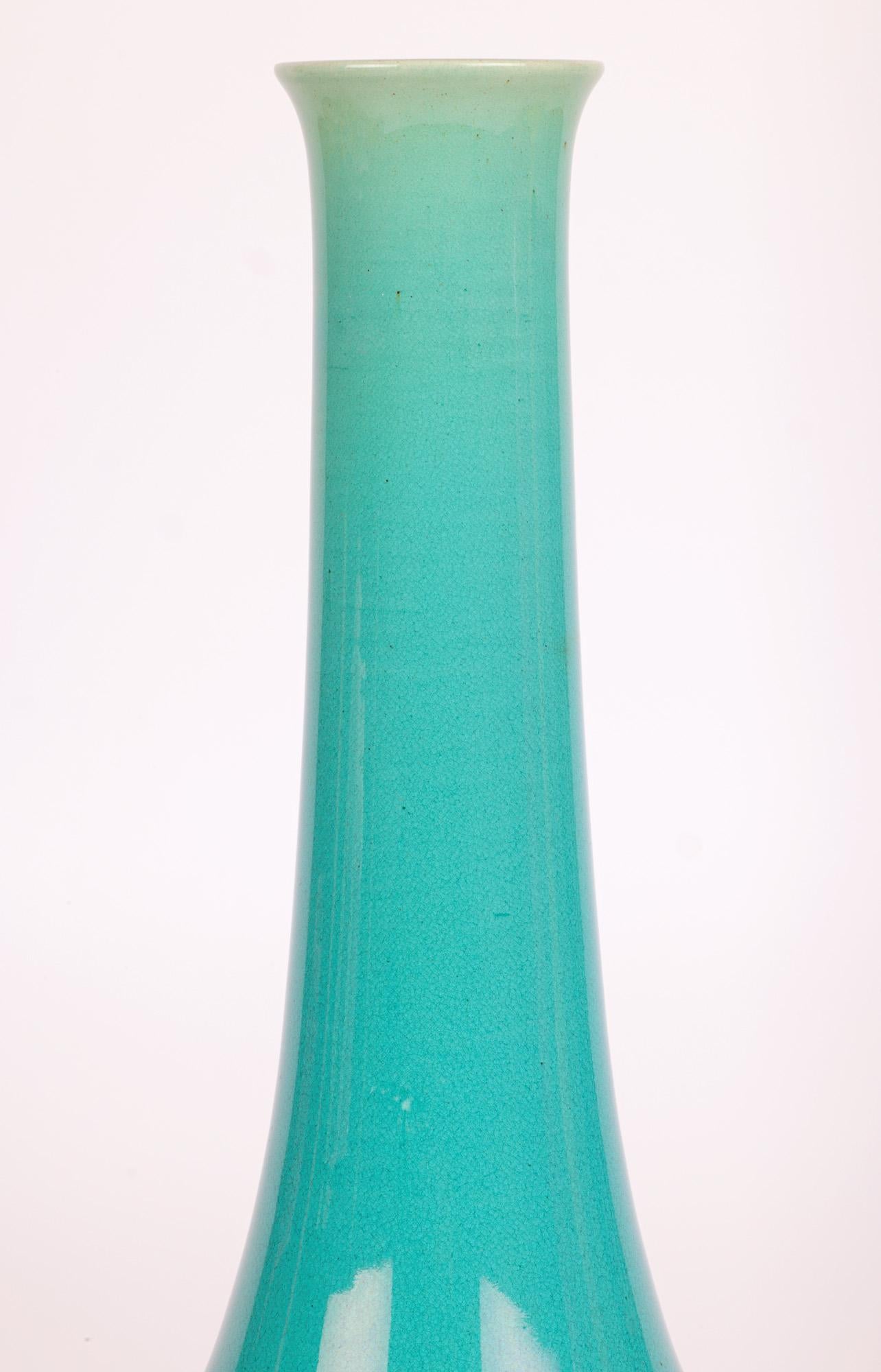 A stylish and large Burmantofts Arts & Crafts turquoise glazed art pottery bud shaped bottle vase made in Leeds and dating from around 1890. 
The vase is part of a private collection of Arts and Crafts influenced pottery amassed in the mid 1980’s.