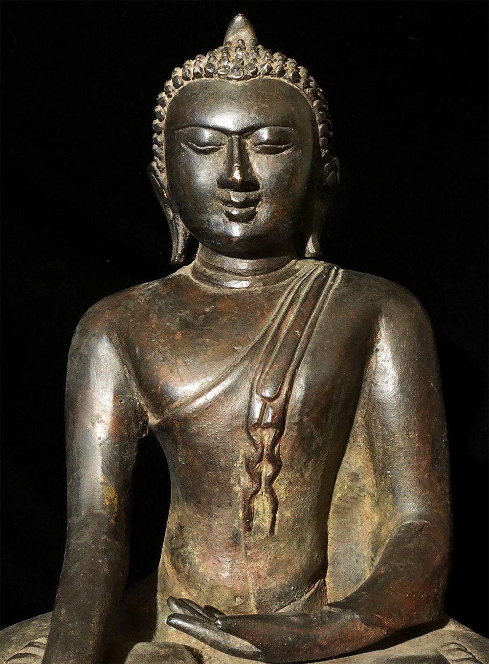 Burmese bronze Buddha, probably 17th/19thC. In a Pagan style, but it is part of a resurgence of this type several hundred years after the actual Pagan period. Buddha is large at 12.25 inches tall, height on custom stand is 14.75 inches. Quite