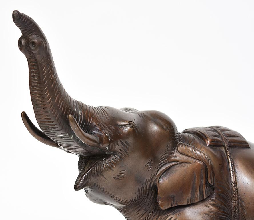 Burmese bronze elephant.

Age: Burma, Contemporary
Size: Height 37.5 C.M. / Width 13.7 C.M. / Length 38 C.M.
Condition: Nice condition overall.
