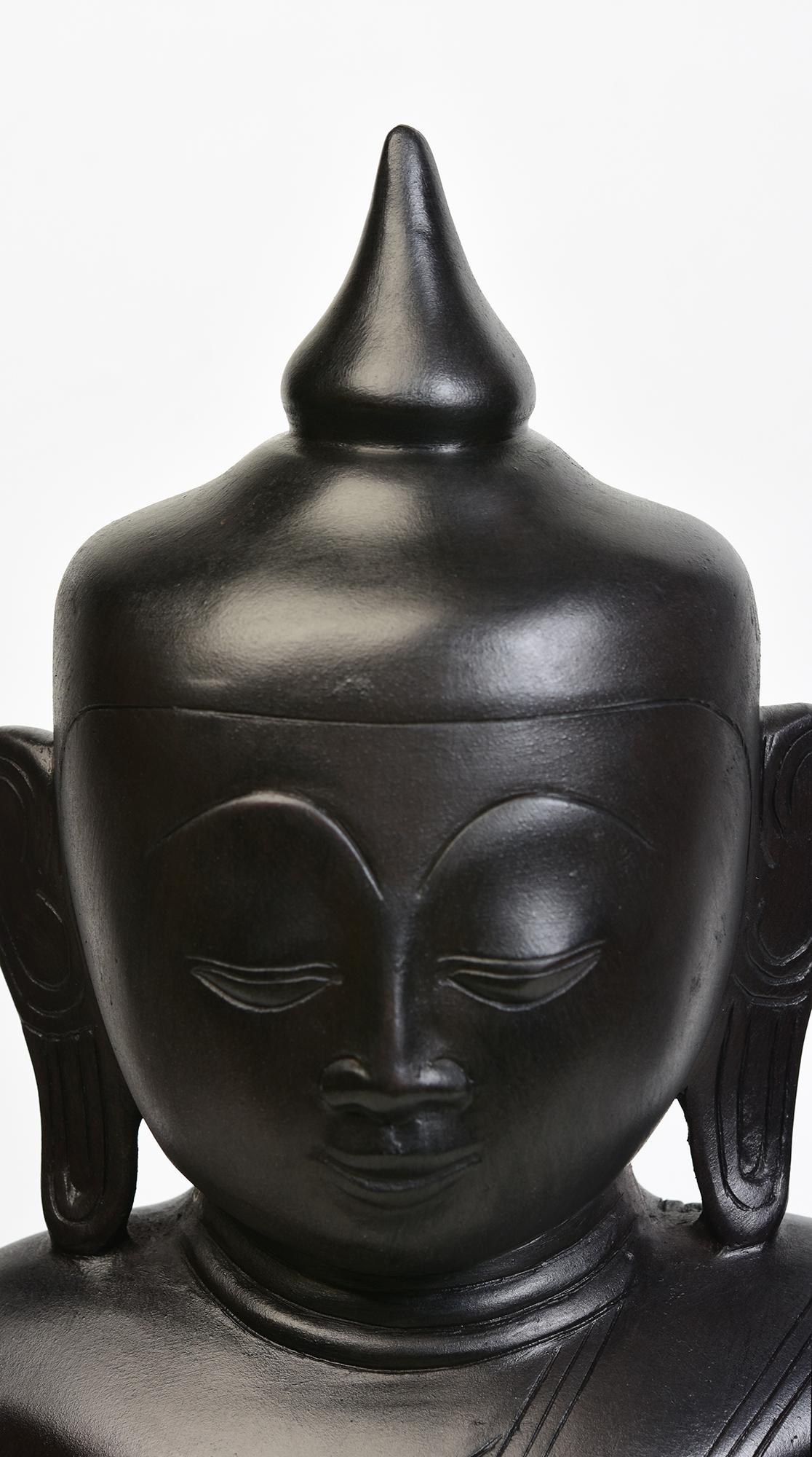 Burmese bronze seated Buddha.

Age: Burma, Contemporary
Size: Height 47 C.M. / Width 26.3 C.M. / Depth 13.5 C.M.
Condition: Nice condition overall.