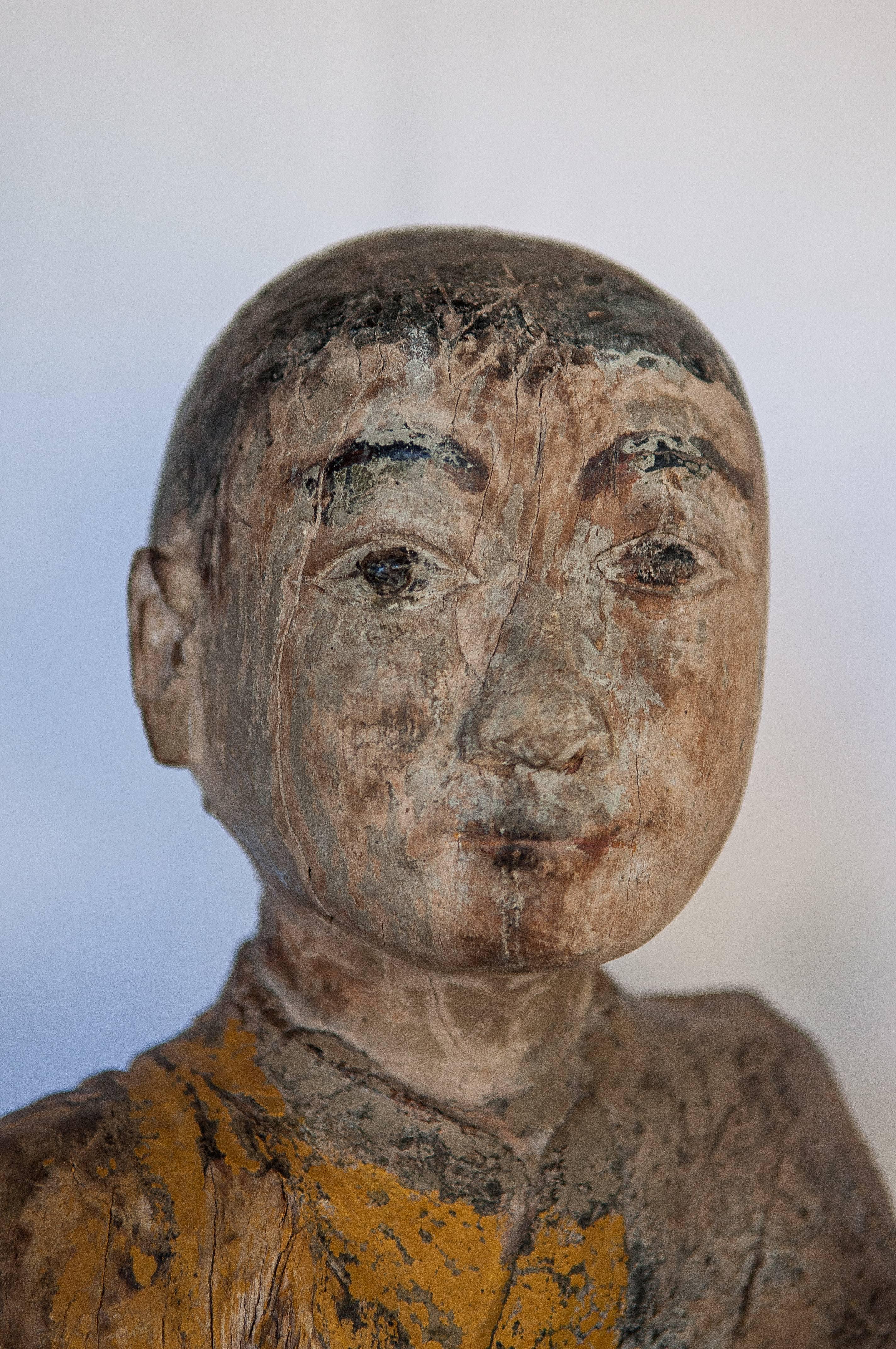 Burmese Buddhist wood carving. Sitting monk or teacher, early 20th century.
This simple yet wonderfully expressive carved figure from Burma was most likely placed in a village shrine or temple. Long years of exposure have eroded the underside of the