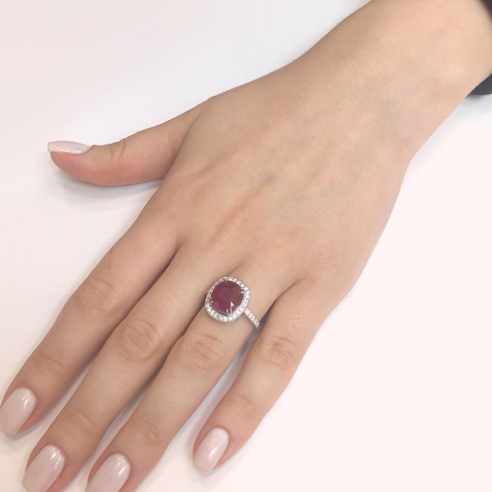Red cushion cut Burmese ruby 5.06 ct.
Round natural white diamonds 0.78 ct.
Diamonds are G-H Color Clarity VS.
Platinum 950 metal.
Width: 1.1 cm.
Length: 1.5 cm.
Weight: 6.2 g.