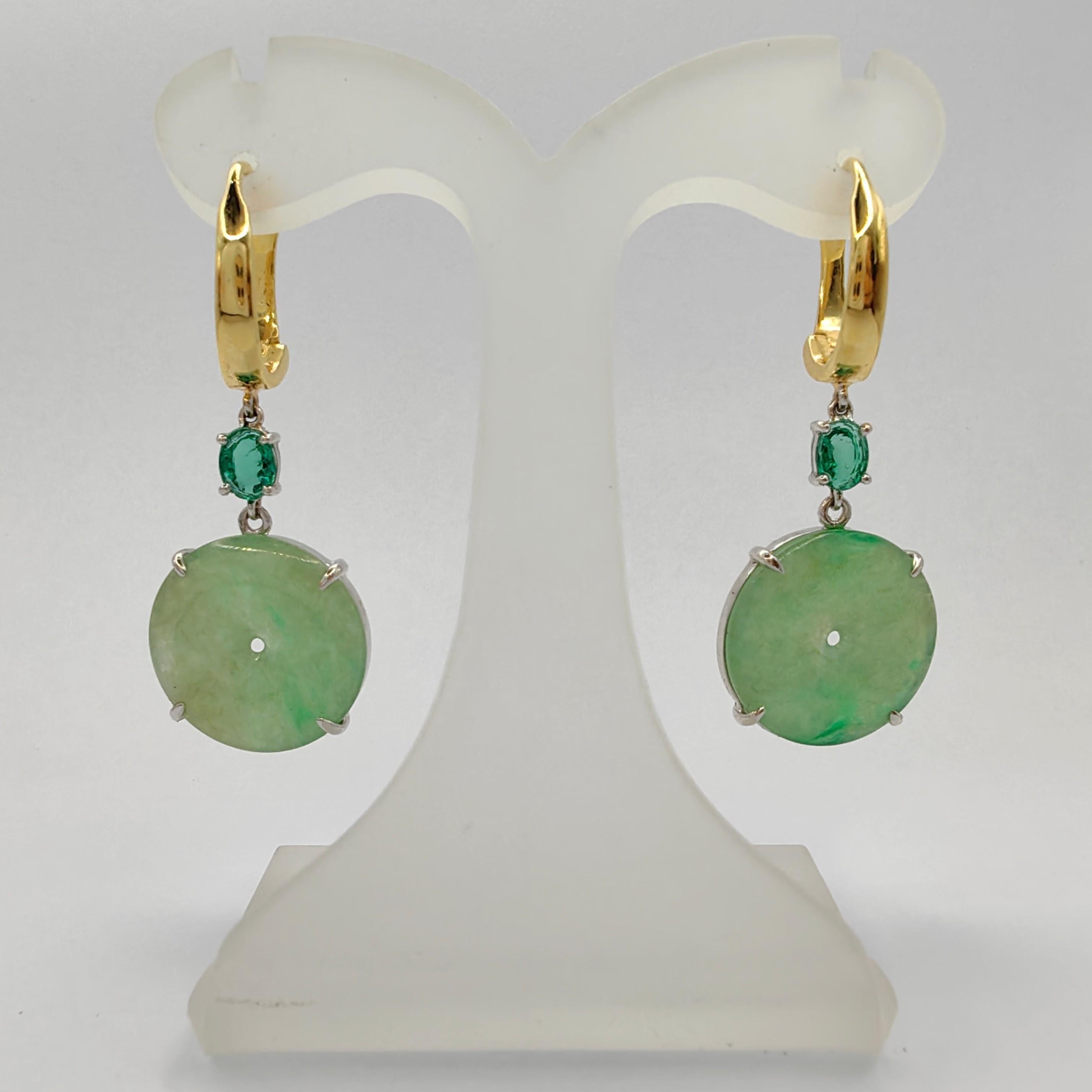 Introducing our exquisite Burmese Jadeite Jade Donut & Emerald Dangling Earrings in 18K Two-tone Gold, a harmonious fusion of nature's beauty and artisanal craftsmanship.

These captivating earrings feature two remarkable donut-shaped Burmese