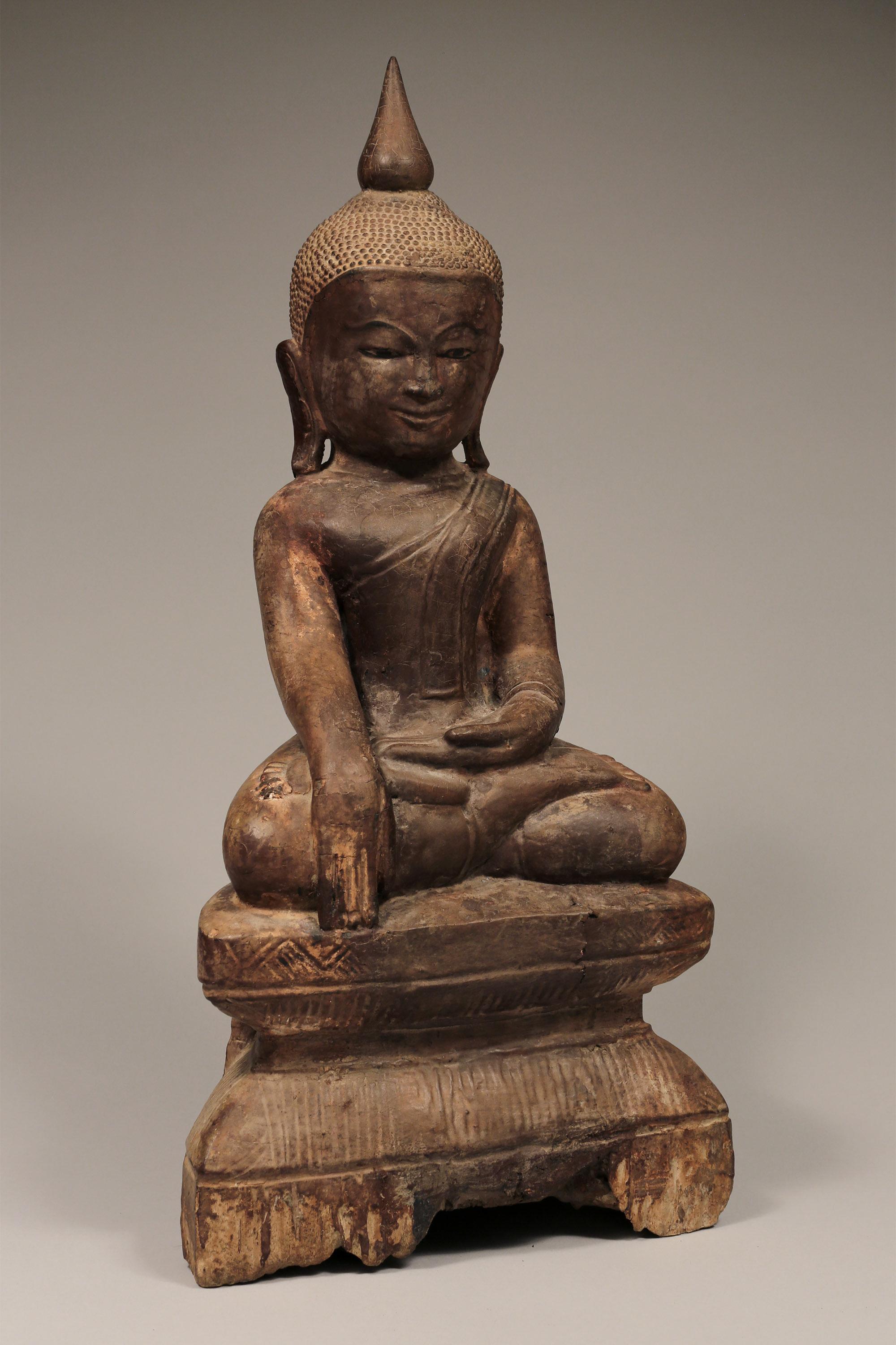 Seated wooden Buddha
Burma,
19th-20th century (Mandalay period)
Measures: H 19.5 x W 9 in x D 4.5 in

Youthful, sweet-faced image of the Buddha, seated in the Bhumisparsa mudra, translated as the “earth touching gesture”.
   