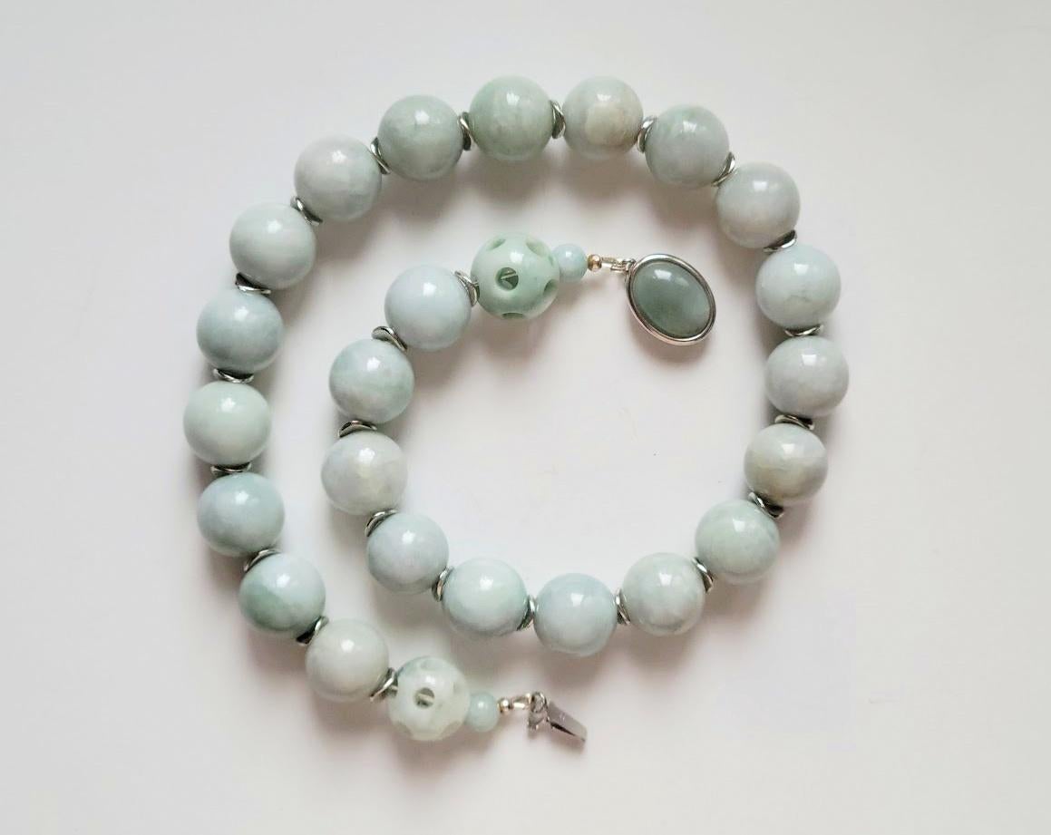 The necklace is 20 inches long (50 cm) and weighs 225 grams (8oz).
The nephrite jade beads are 17.5 mm in diameter, and the silver spacer beads are 8x1 mm.
The necklace is fastened with a 925 silver clasp with natural jade cabochon.
The jade beads
