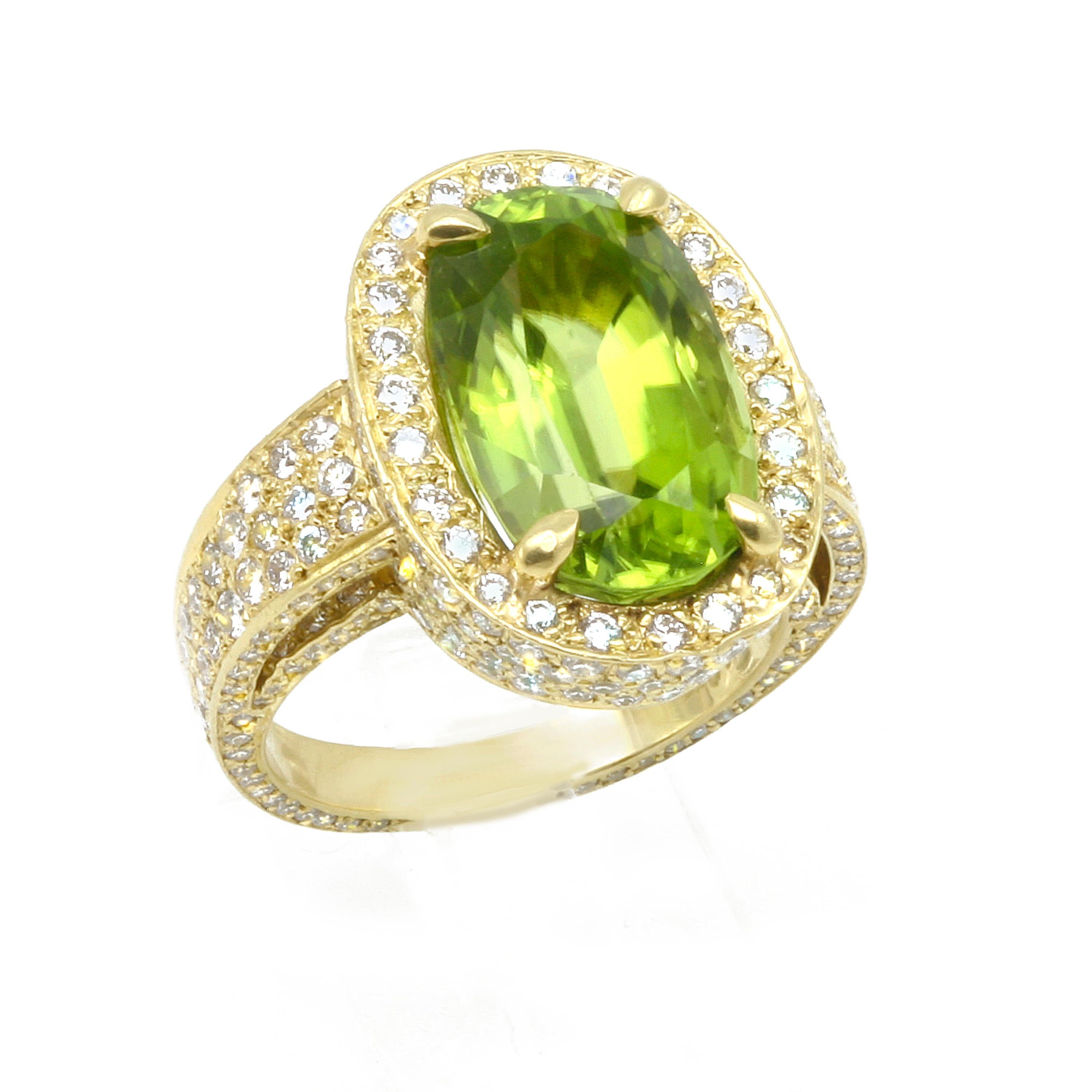 A statement ring, this 8.51 Carat Burmese Peridot Ring is set with 2.69  G-H color, VS2 Diamonds. Set in 18k Gold, the sparkle of almost three carats of diamonds gleam from all sides of this ring. The micro pave shanks are set inside the split sides