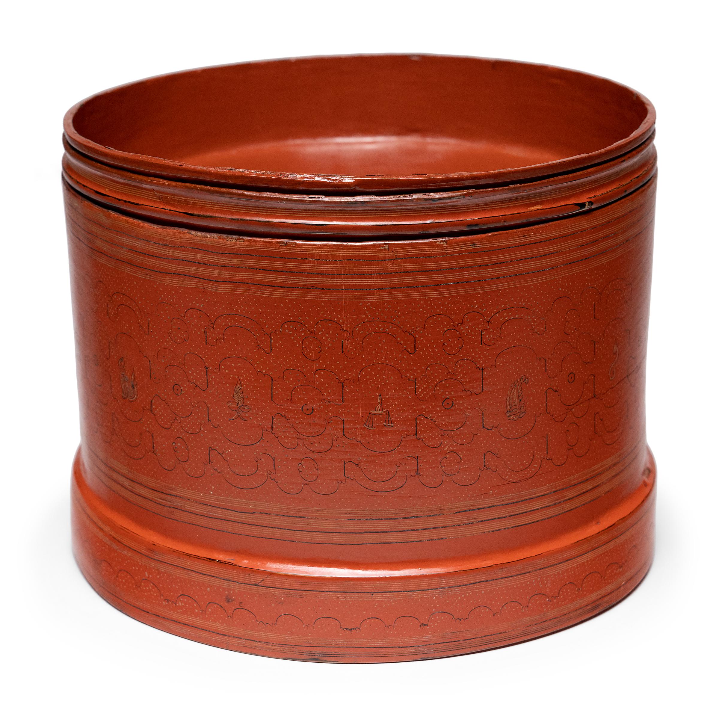 This set of red lacquer trays are components of an early 20th century Burmese betel box (kun-it). A blend of betel leaves, areca nuts, slaked lime, and sometimes tobacco, betel quid (paan) is a common medicinal chew throughout southeast Asia and was