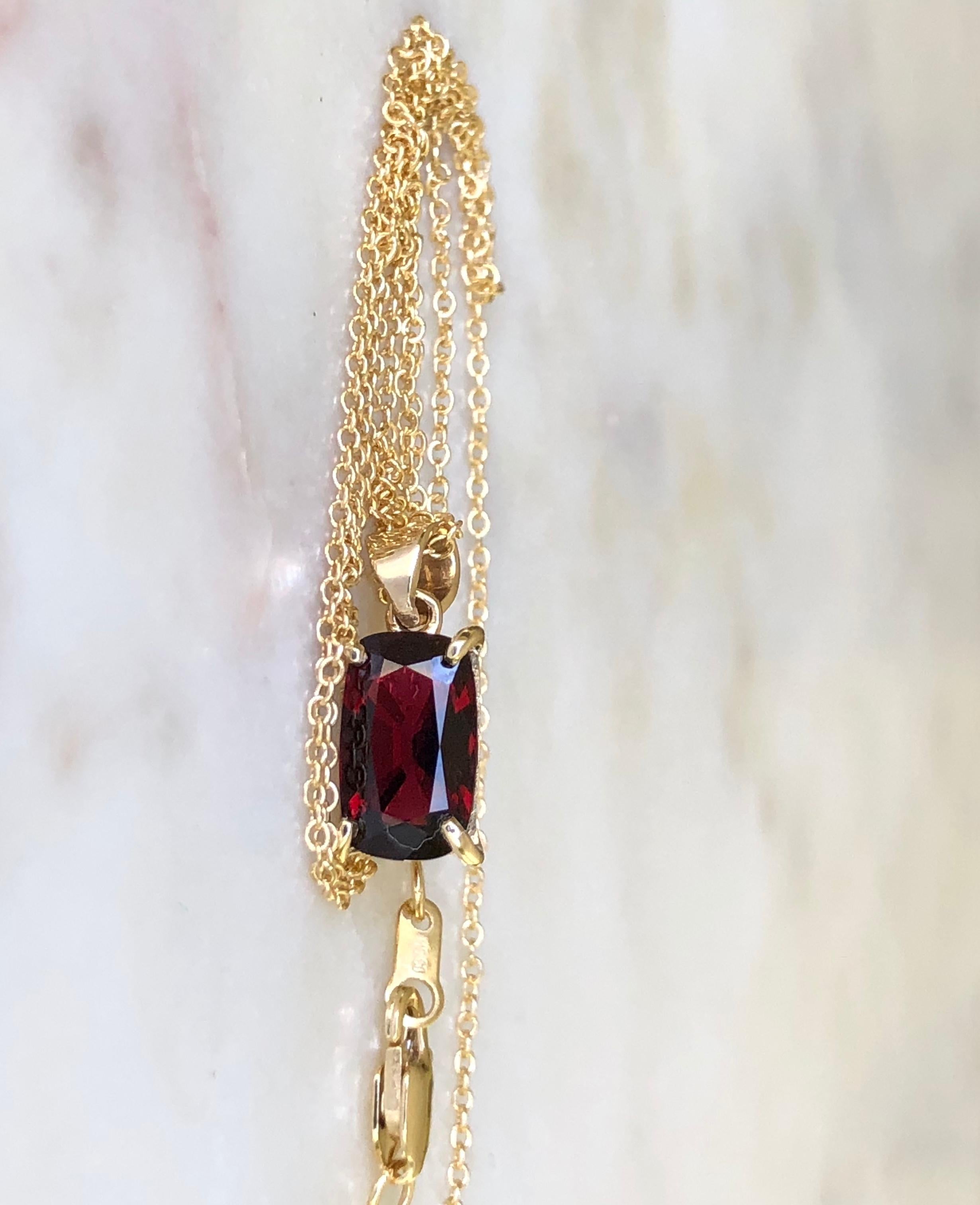 Classic 18k yellow gold natural Burmese  red spinel approx. 1.15 carat drop solitaire pendant necklace. 
A cushion brilliant cut natural Burmese spinel with a bright red color, VS in clarity.   
Pendant Length 15mm 
Pendant Width 6mm 
Excellent