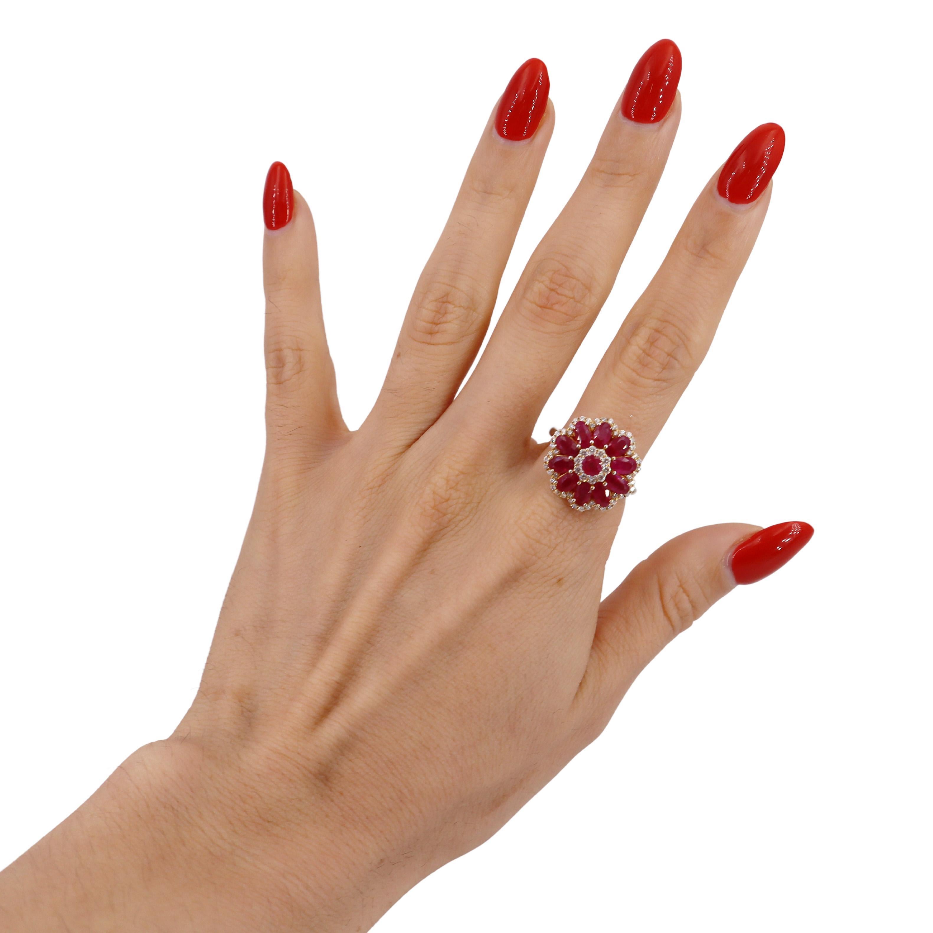 Elevate your jewelry collection with this stunning cocktail ring, expertly crafted in 18k yellow gold. This exquisite piece is adorned with 11 oval-shaped and round-cut pink heated transparent Burma rubies, boasting a total weight of