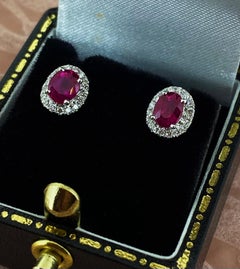 Burmese Ruby (0.60ct) & Diamond Halo Style Stud Earrings in 18K White Gold.