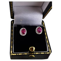 Burmese Ruby (0.60ct) & Diamond Halo Style Stud Earrings in 18K White Gold.