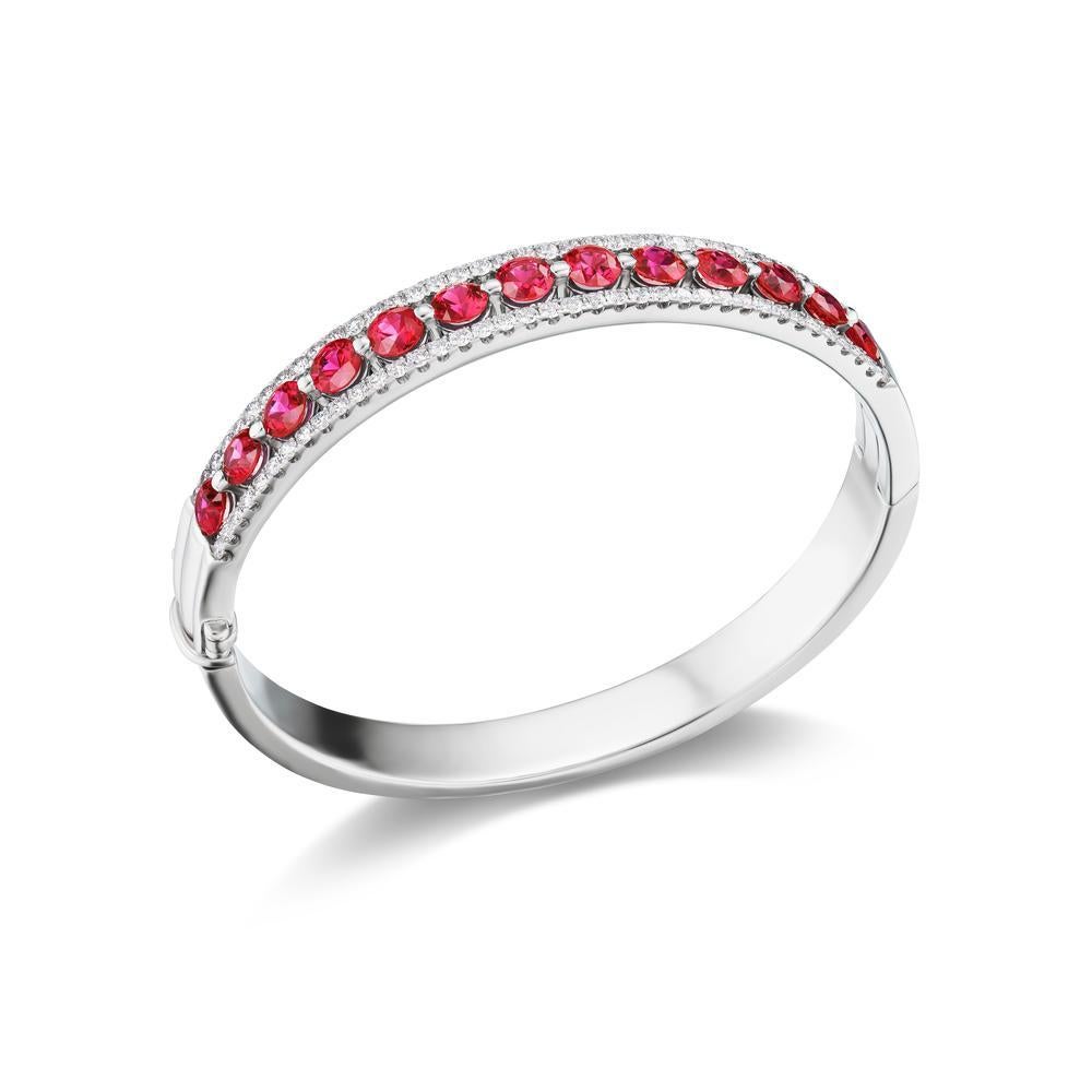 BURMESE RUBY AND DIAMOND BANGLE
Gorgeous GIA certified Burmese Rubies and diamonds secured in a
classy prong setting and display a beautiful hue of red through this
gorgeous piece.
Item: # 04148
Metal: 18k W
Lab: Gia
Color Weight: 7.20 ct.
Diamond