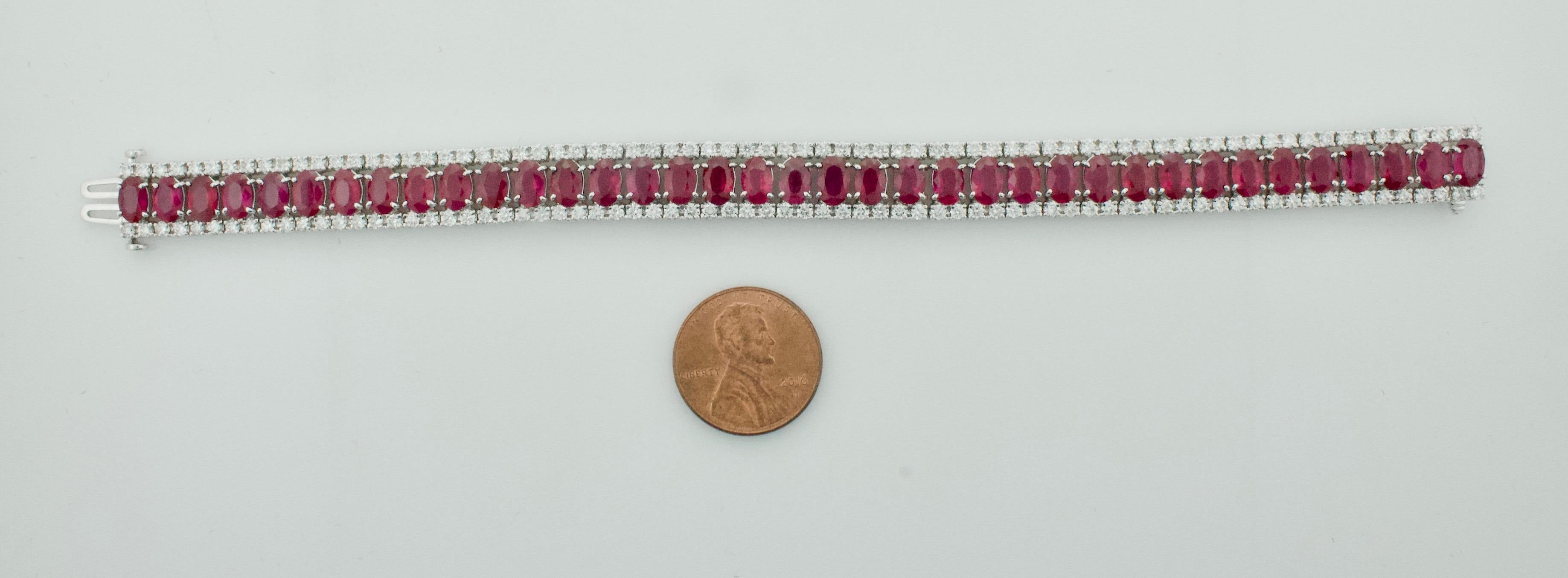 Burmese Ruby and Diamond Bracelet with GIA Certificate  20.00 carats of Rubies 
Thirty Eight Oval Burmese Rubies weighing 20.00 carats approximately [bright with no imperfections visible to the naked eye]
One Hundred and Fifty Two Round Brilliant
