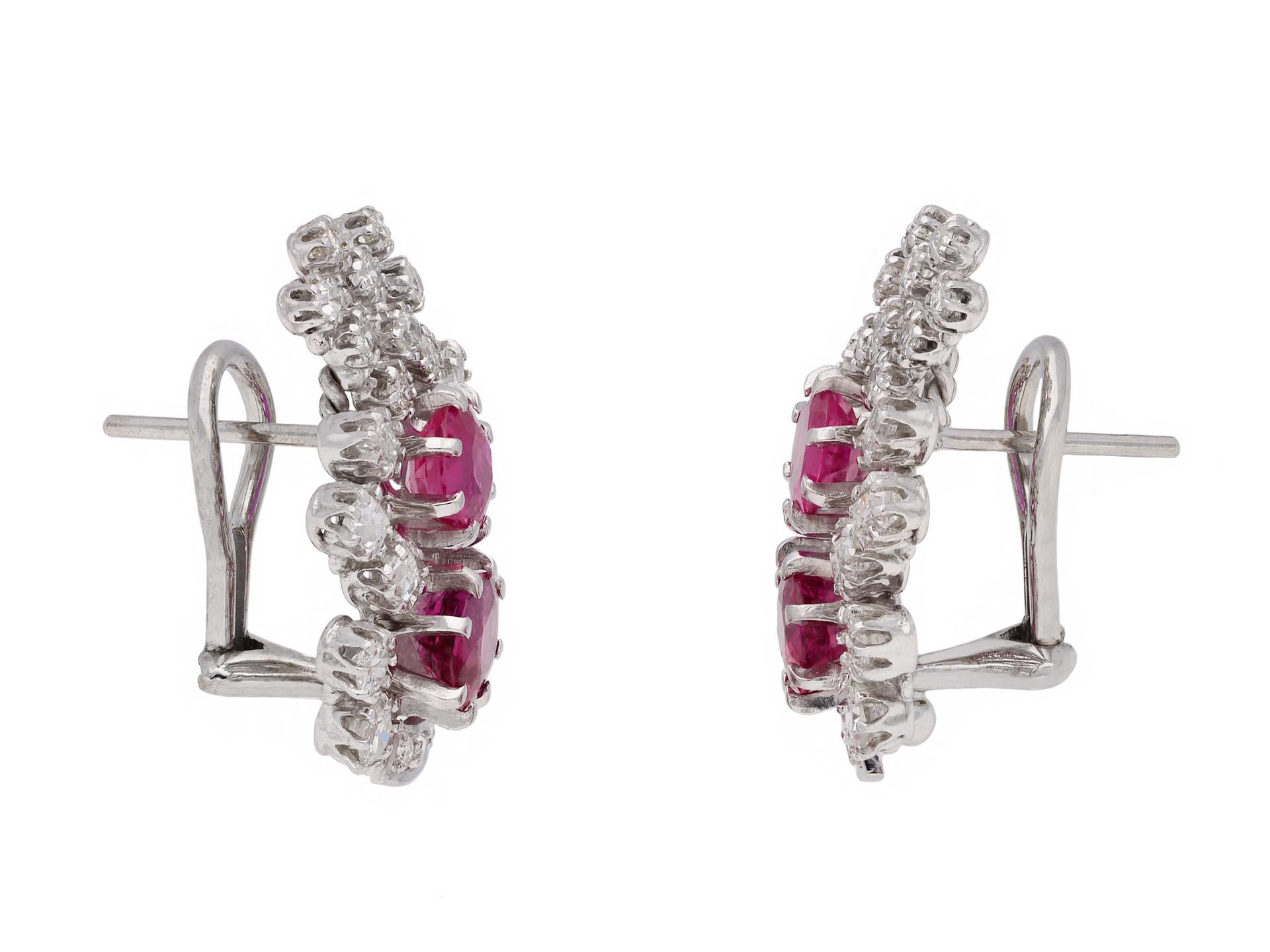 Burmese ruby and diamond earrings. A matching pair, each set with two cushion shape old cut natural no heat Burmese rubies in open back claw settings, four in total with a combined approximate weight of 2.60 carats, further adorned with six