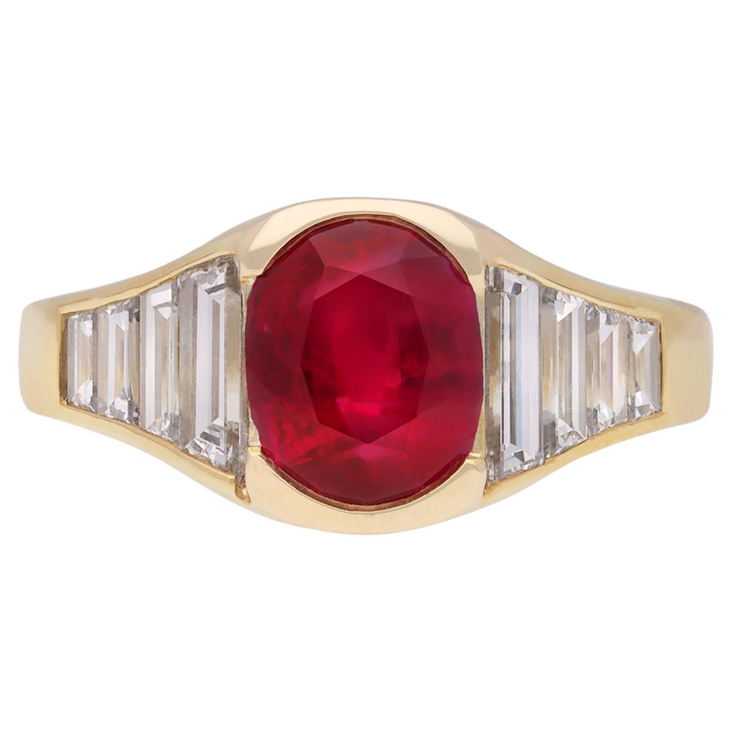 Burmese ruby and diamond flank solitaire ring, circa 1950. For Sale