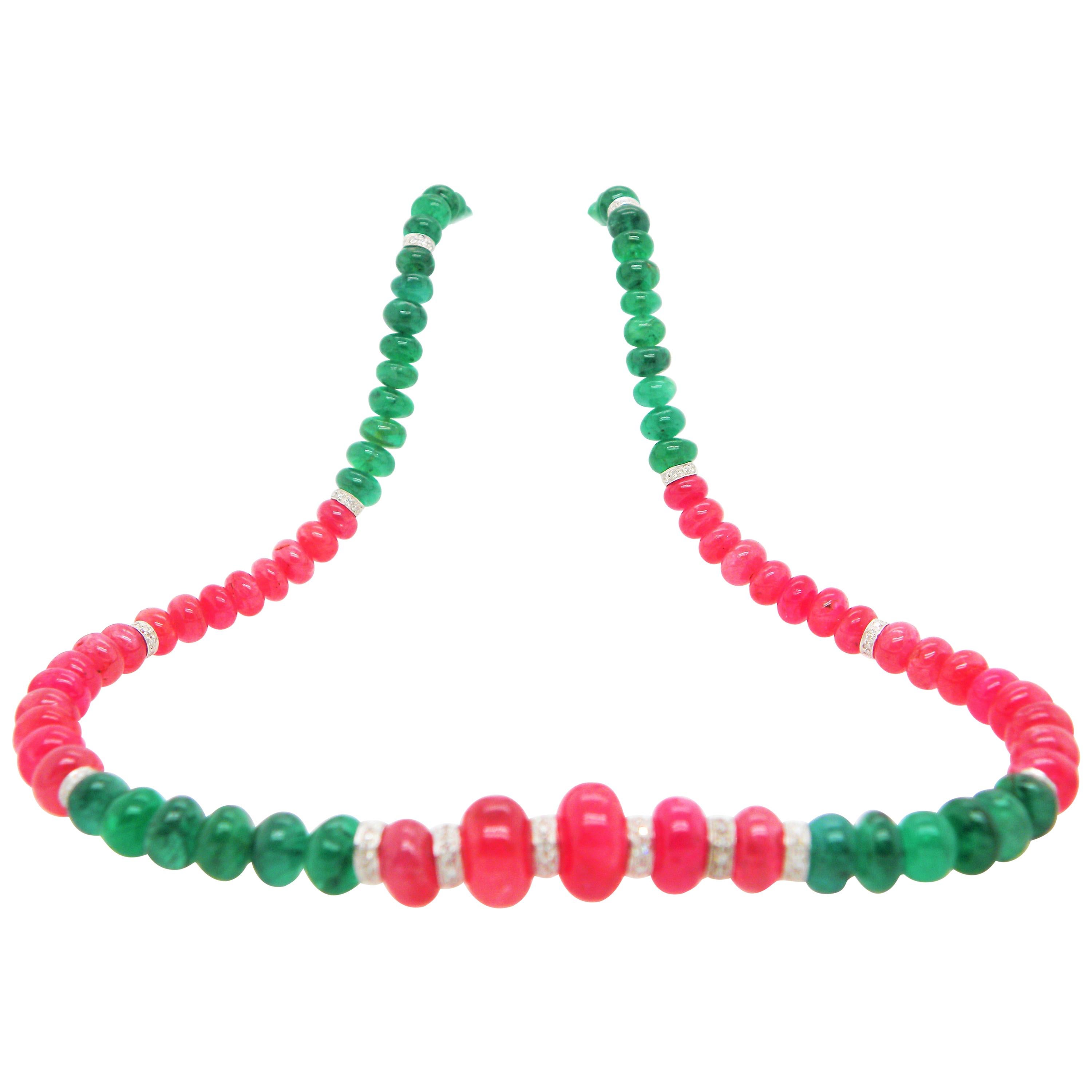 Burmese Ruby and Emerald Beads White Diamond Gold Necklace: 

A beautiful necklace, it features luscious Burmese ruby and emerald beads weighing 121.98 carat and 65.42 carat respectively, with 14 white round brilliant diamond rondelles interspersed