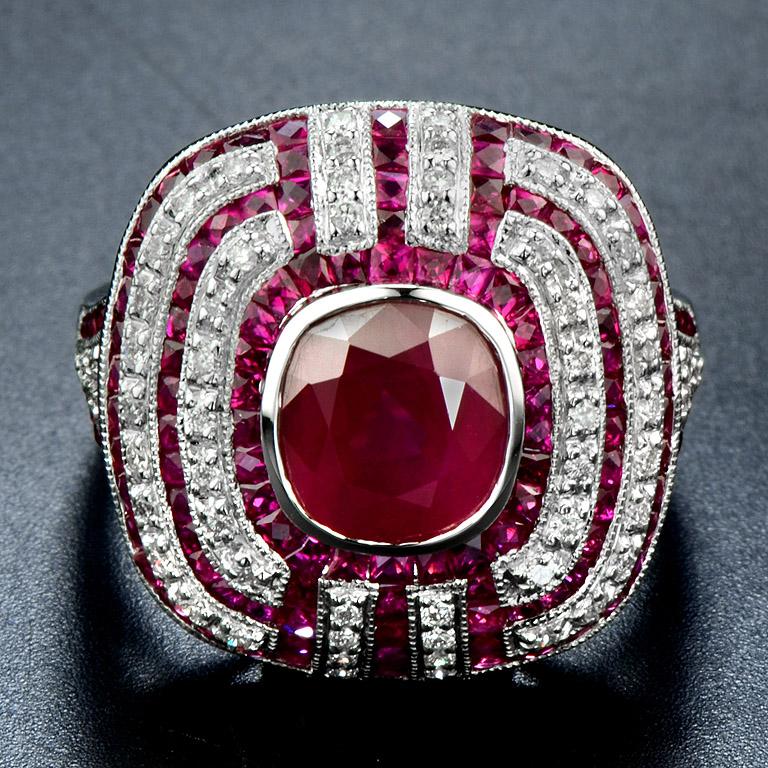 An Art Deco style ring was made in 18K White gold size US. 7

The center Ruby (No glass filled) is 2.70 carat with French cut Natural Ruby lines total 2.30 carat and diamond H color SI2 clarity 0.32 carat.