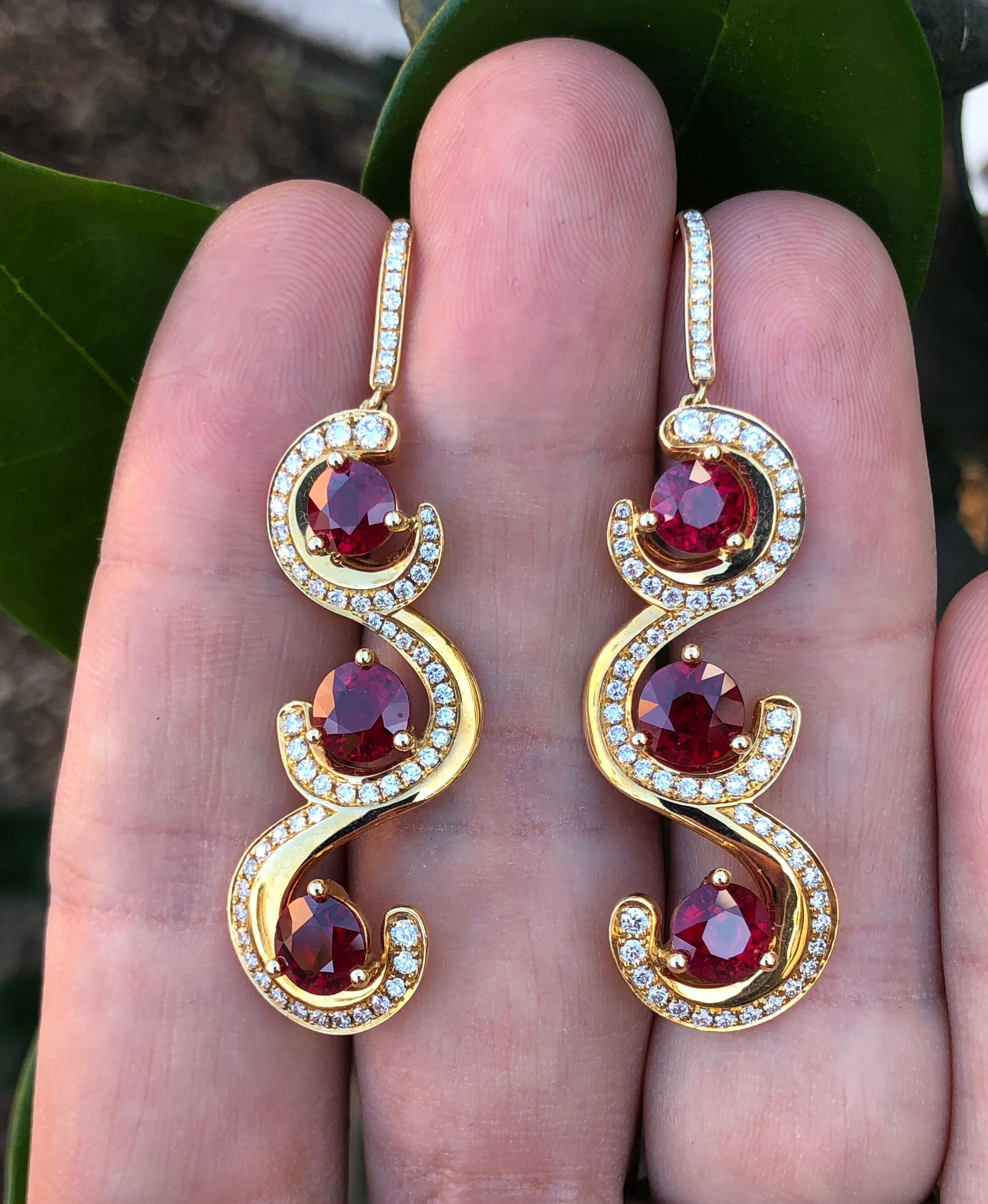 Ultra fine 7.19 carats total Burma Ruby rounds, and a total of 1.10 carat round brilliant diamonds are hand set in these spectacular 18K yellow gold earrings. 
Total length - 2 inches
Returns are accepted and paid by us within 7 days of