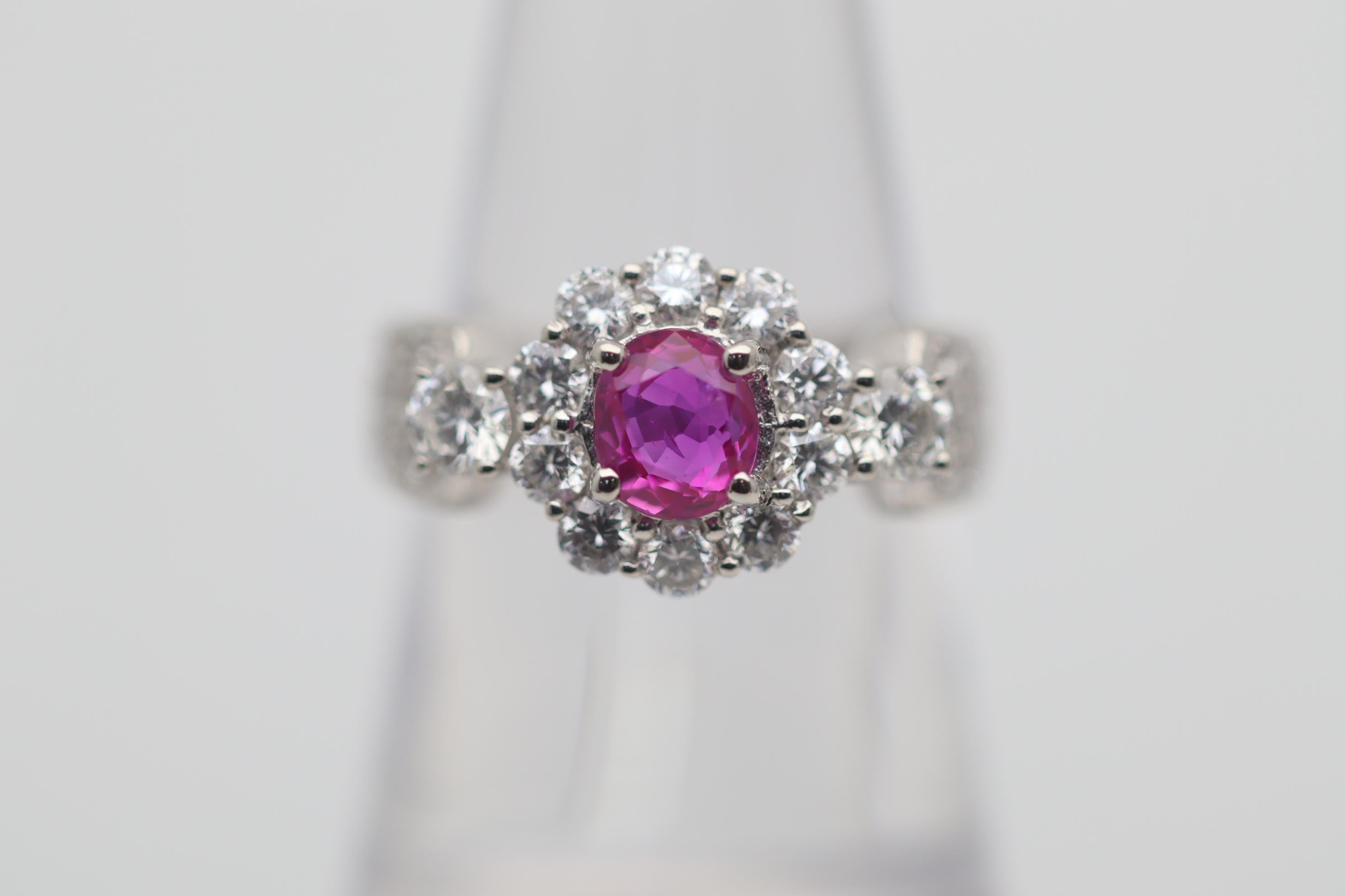 A fine platinum ring featuring a gem Burmese ruby from the famed mines of Mogok. The ruby weighs 1.07 carats and has an intense vivid pinkish-red color which glows in the light. Adding to that, the ruby is certified by the GIA as natural with a