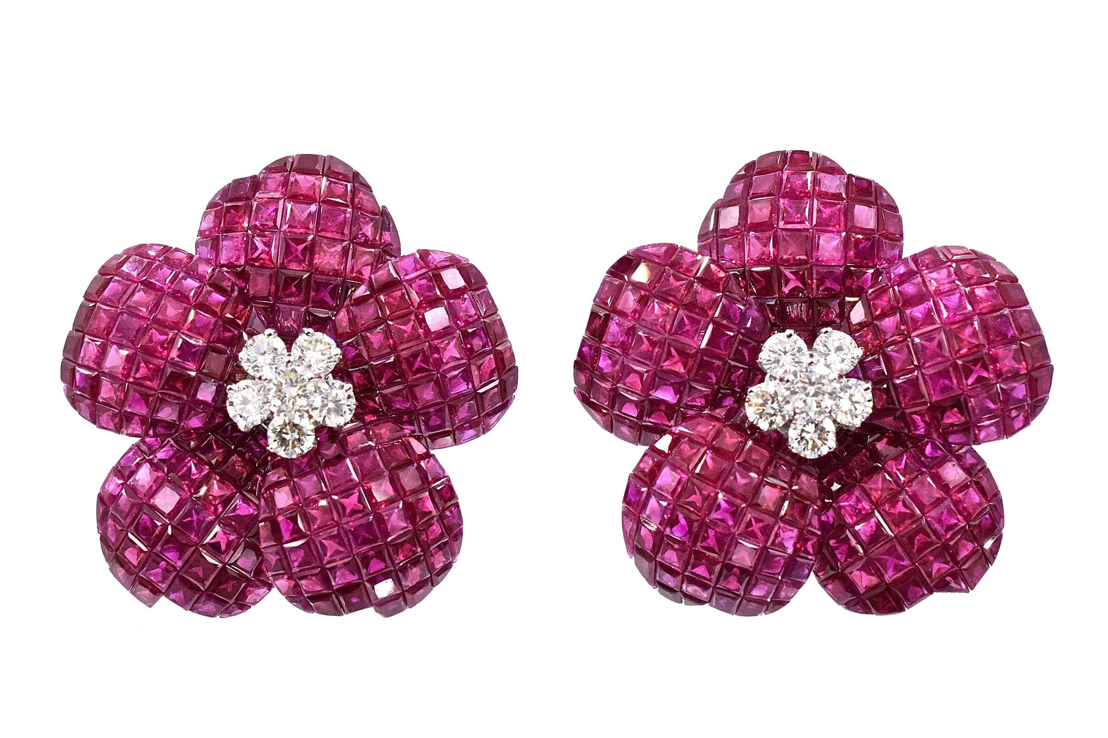 Classic  ruby and diamond flower earrings. 
Five mystery set ruby flower petals centered with 5 diamonds.
Estimated total ruby weight is 46.88 carats and total diamond weight is 1.5 carats
18 K gold with with omega lock. 

