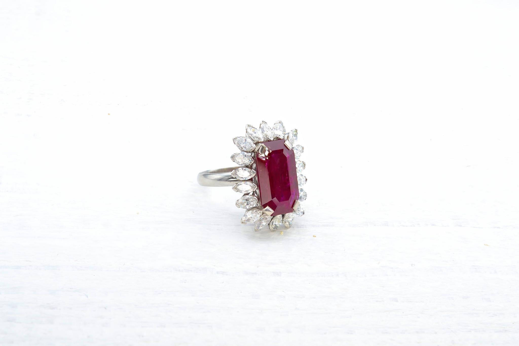 Emerald Cut Burmese ruby ring of 10.80 carats and shuttle diamonds For Sale