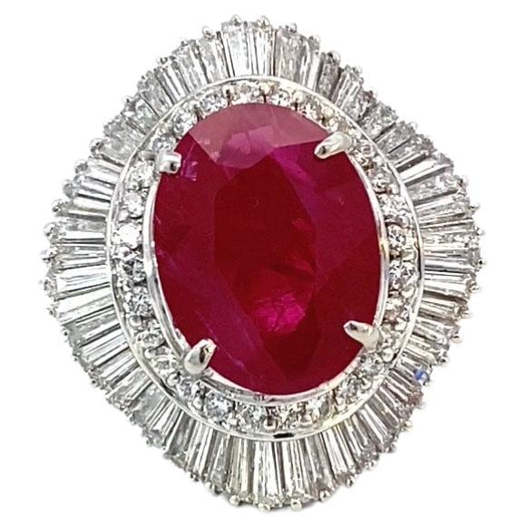 Item #8055

GIA Certified 
Platinum Ladies Ring 7.17 carat Burmese Ruby (heated) with 2.62 carat Diamonds 
Center stone set in a white metal ring with numerous near colorless round brilliants and tapered baguettes.

Colored Precious Stone: 7.17 ct