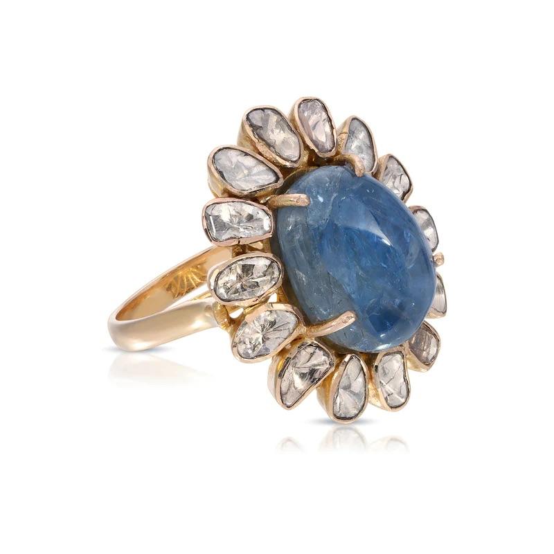 Burmese Sapphire Diamond Cocktail Ring featuring a certified Burmese blue cabochon sapphire in a halo of glittering polki diamonds in a stunning cocktail ring.

- Burmese Blue Sapphire 15.23 carats.
- Fine quality Polki Diamonds Diamonds 1.60