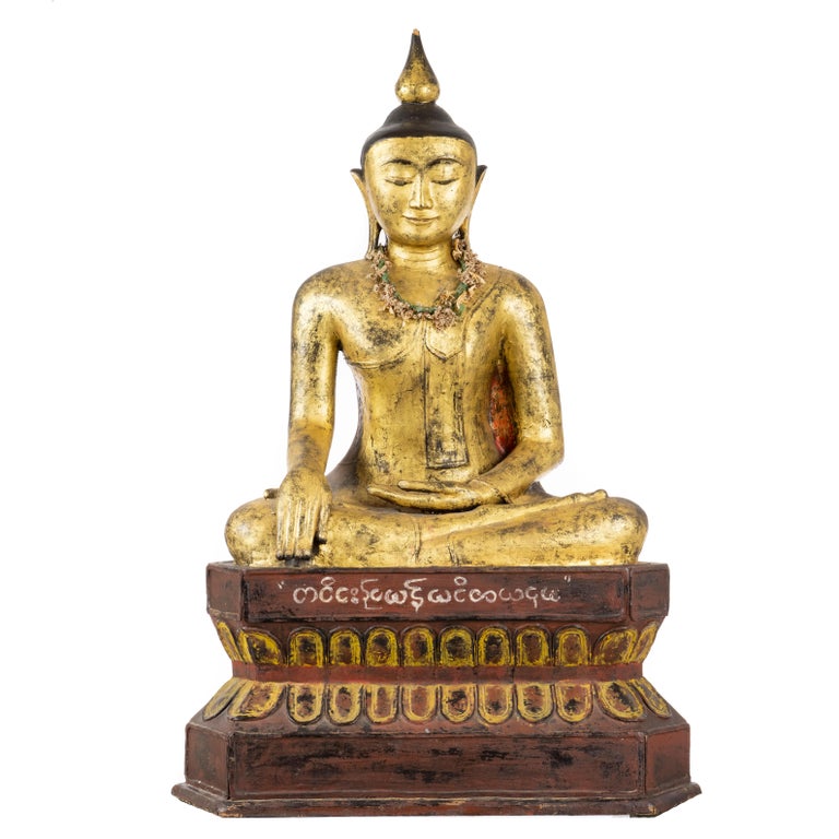 A Burmese, Shan, 18th/19th century, well carved in polychrome and gilt lacquered wood, depicting the Shakyamuni Buddha with mudra hands.